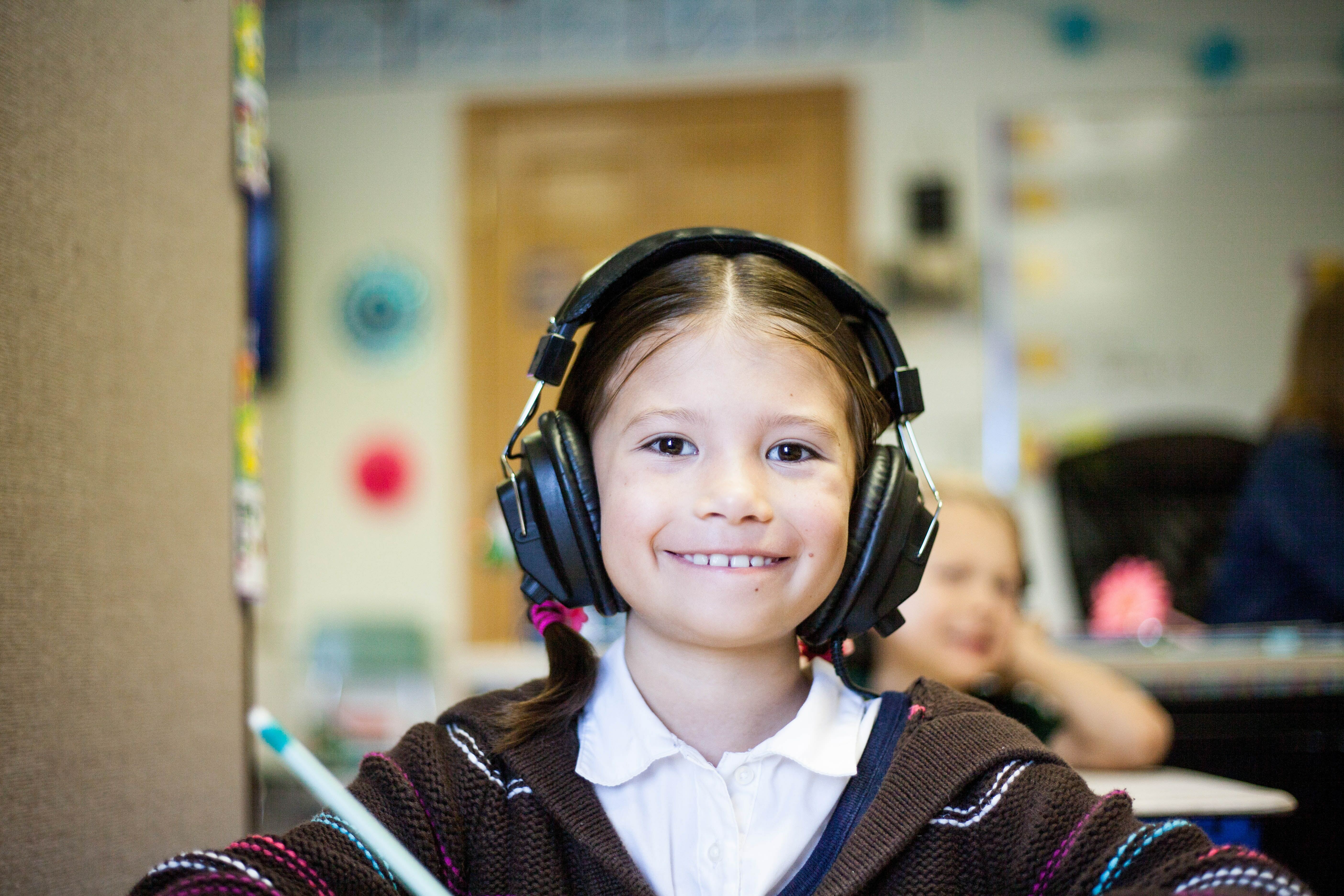 A child wearing a headset