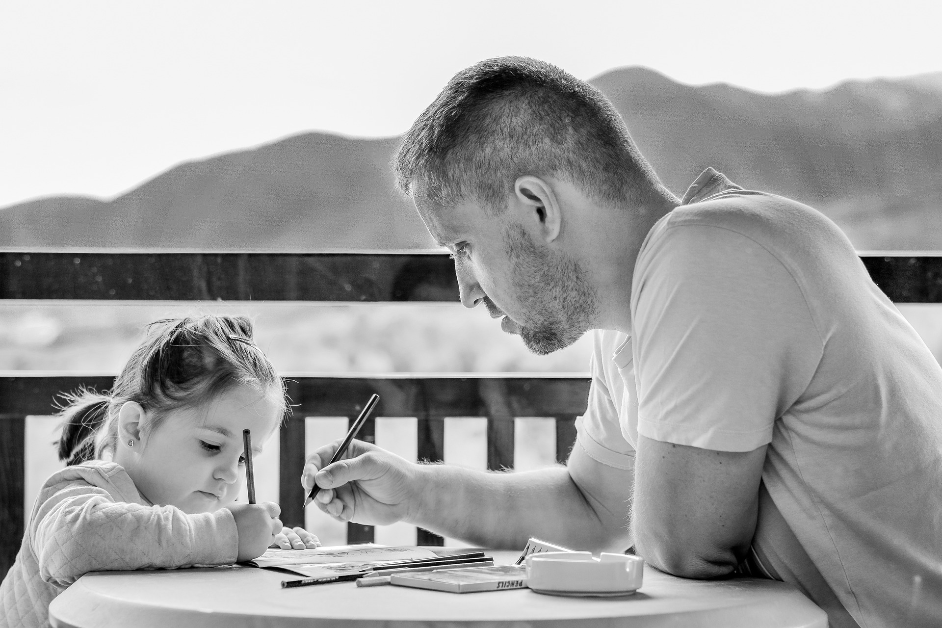 A father and a child studying