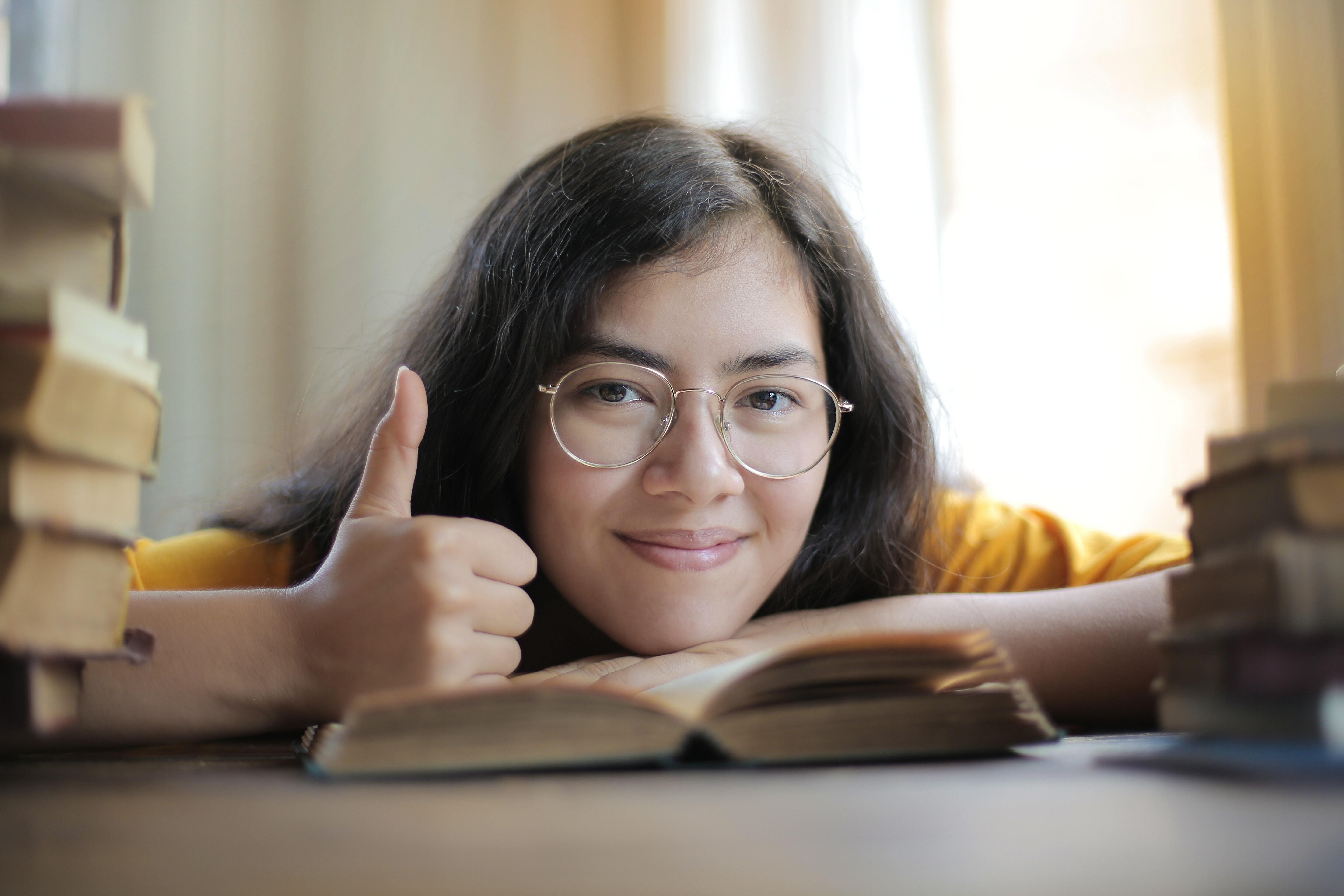 A woman doing thumbs up