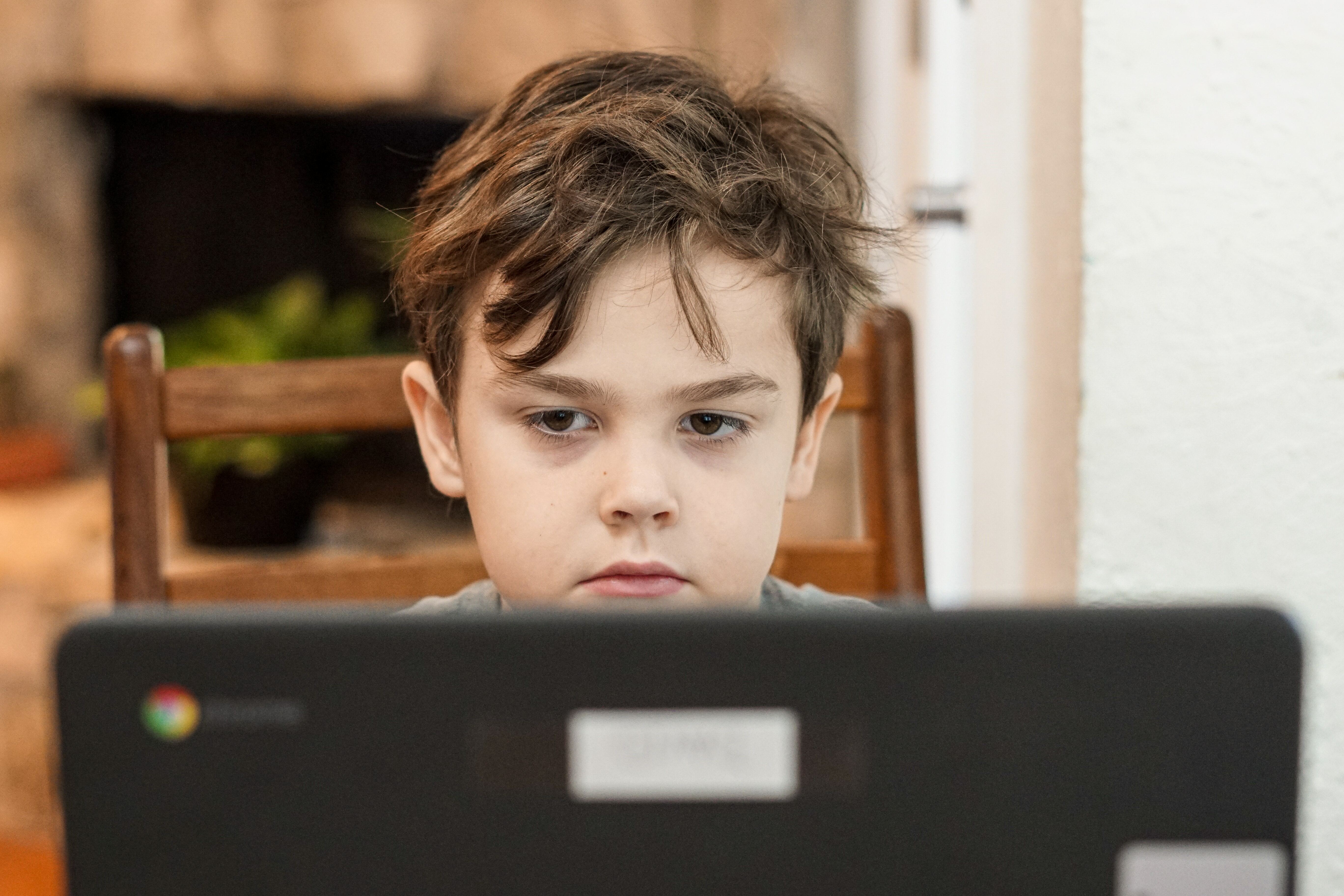 Boy in front of laptop