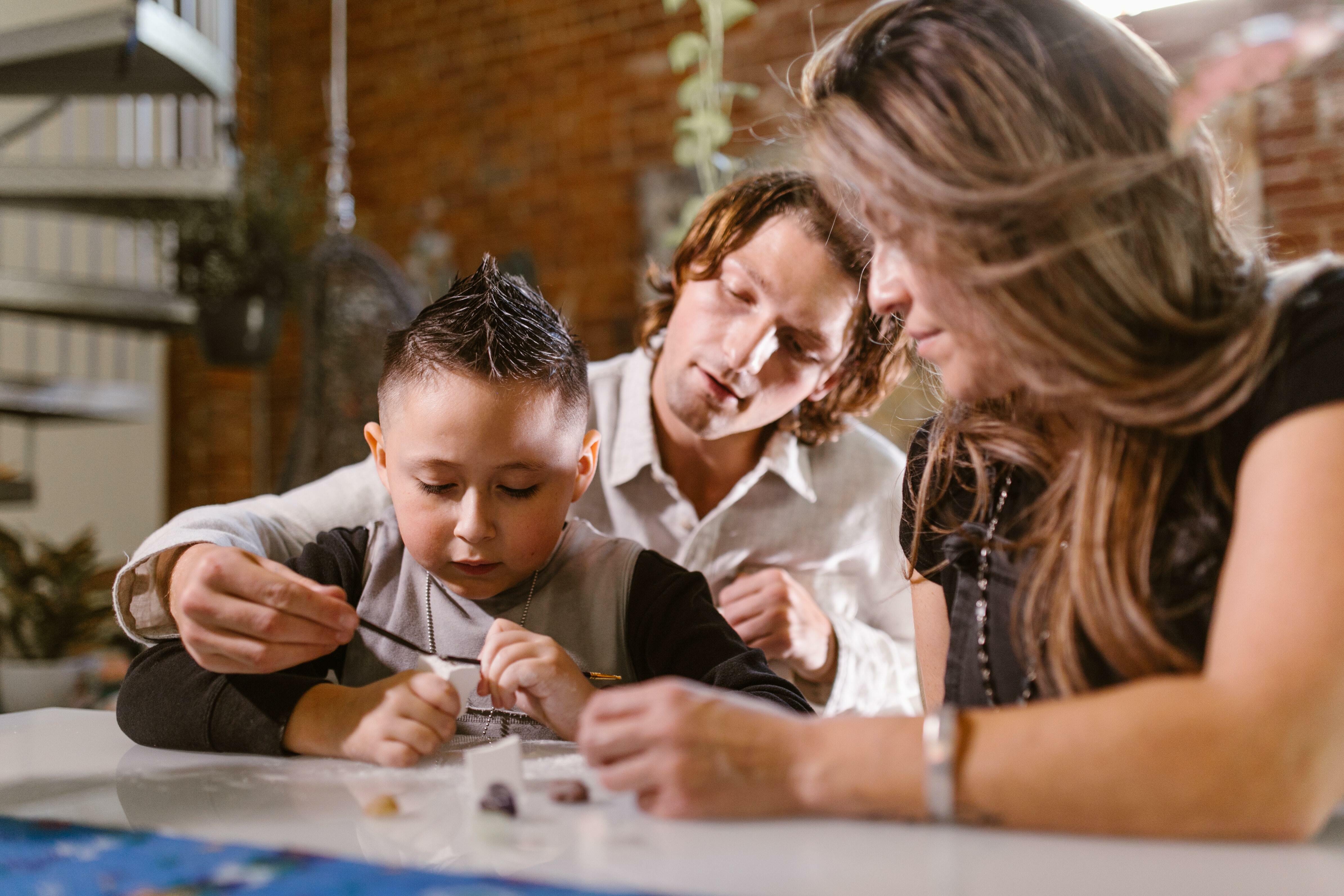 Parents homeschooling a child