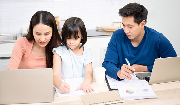 Parents homeschooling a child