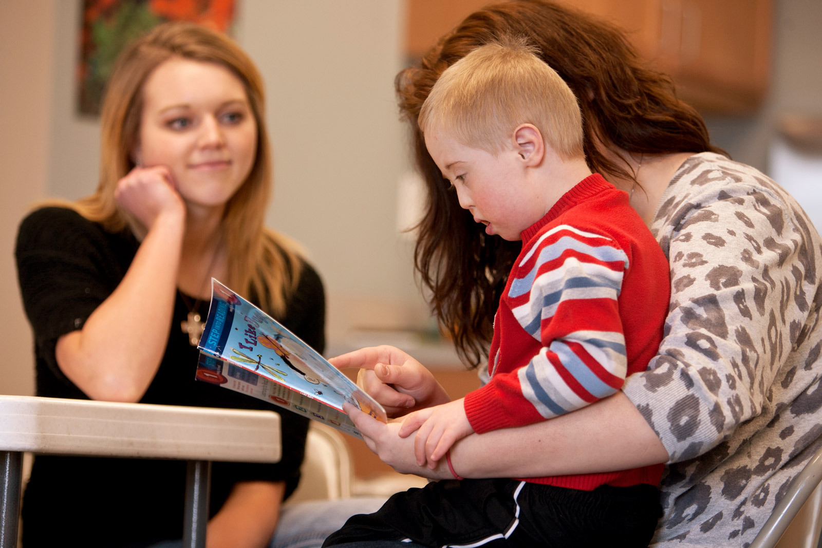 A special needs boy reading