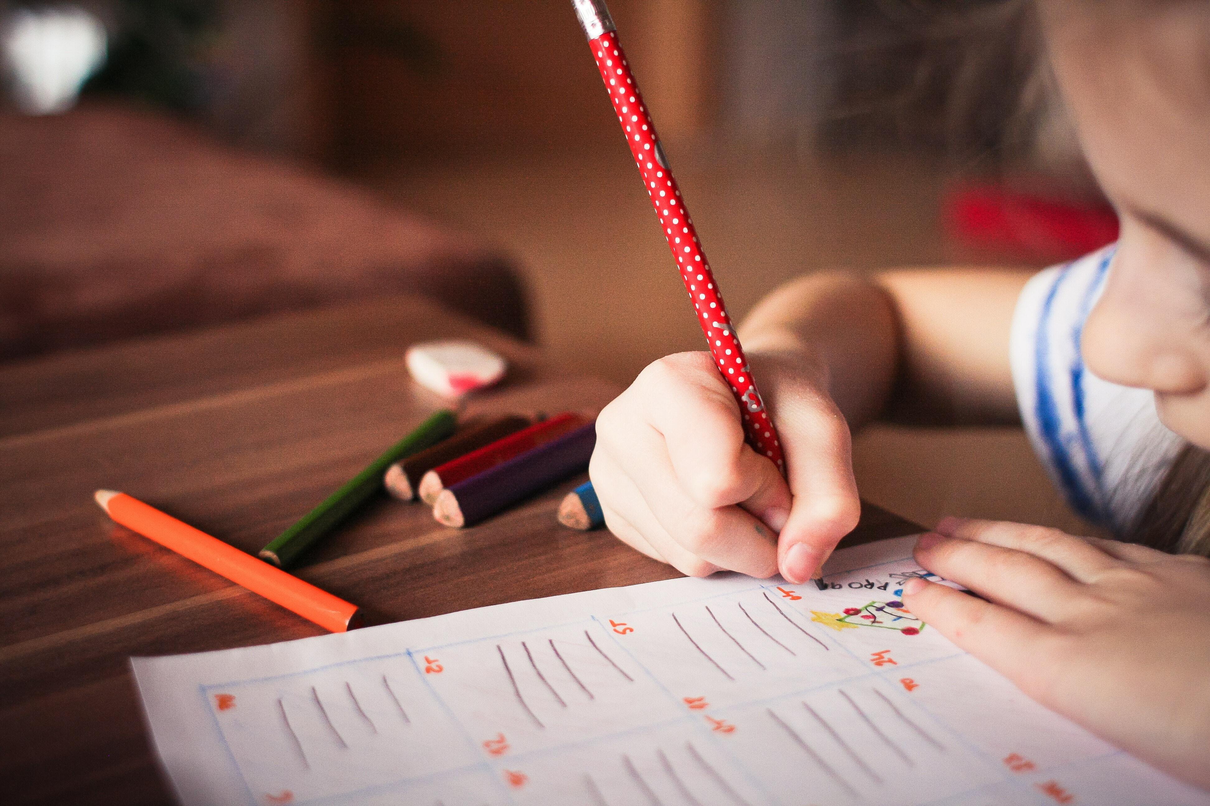 A child writing on a book