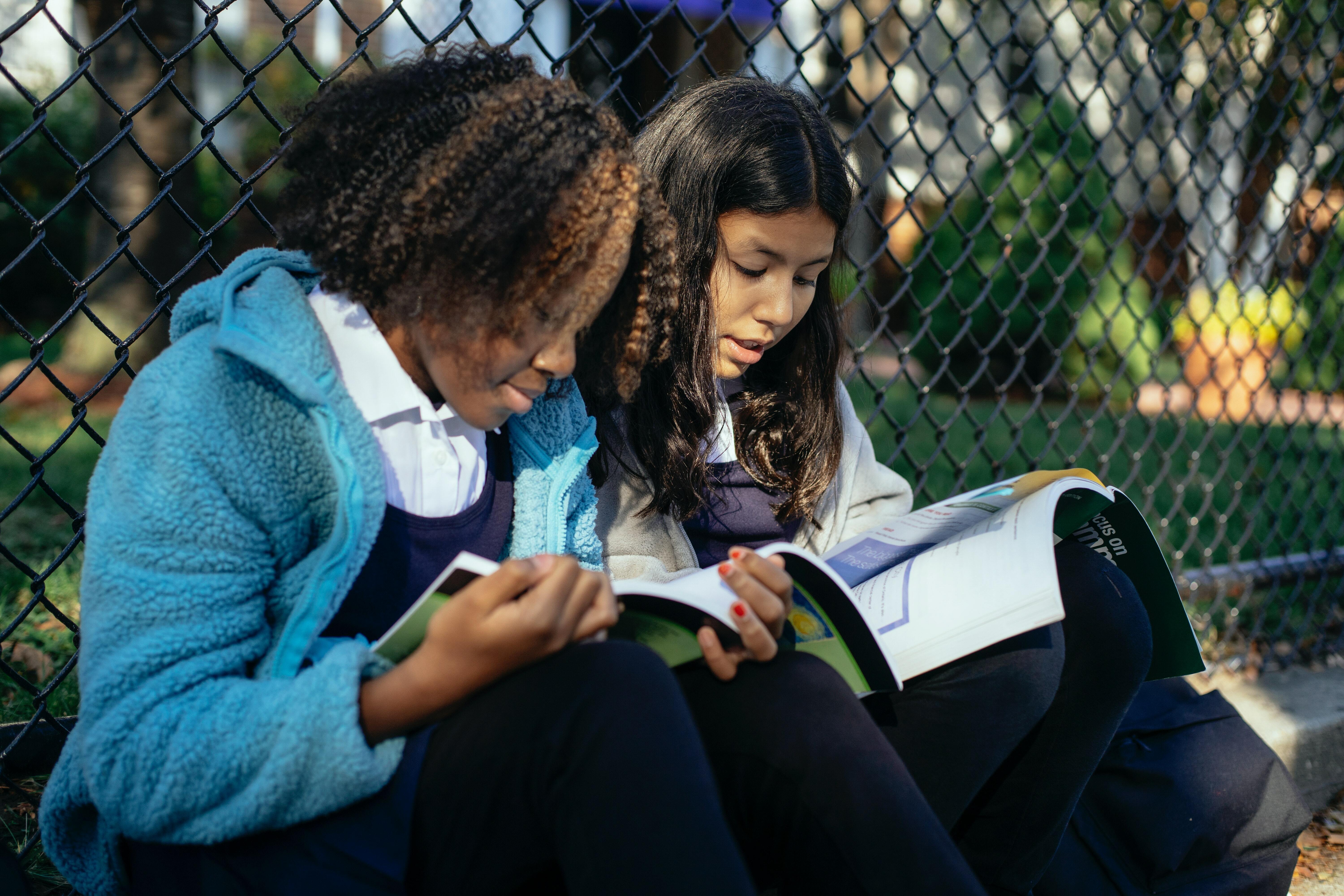 Two children writing