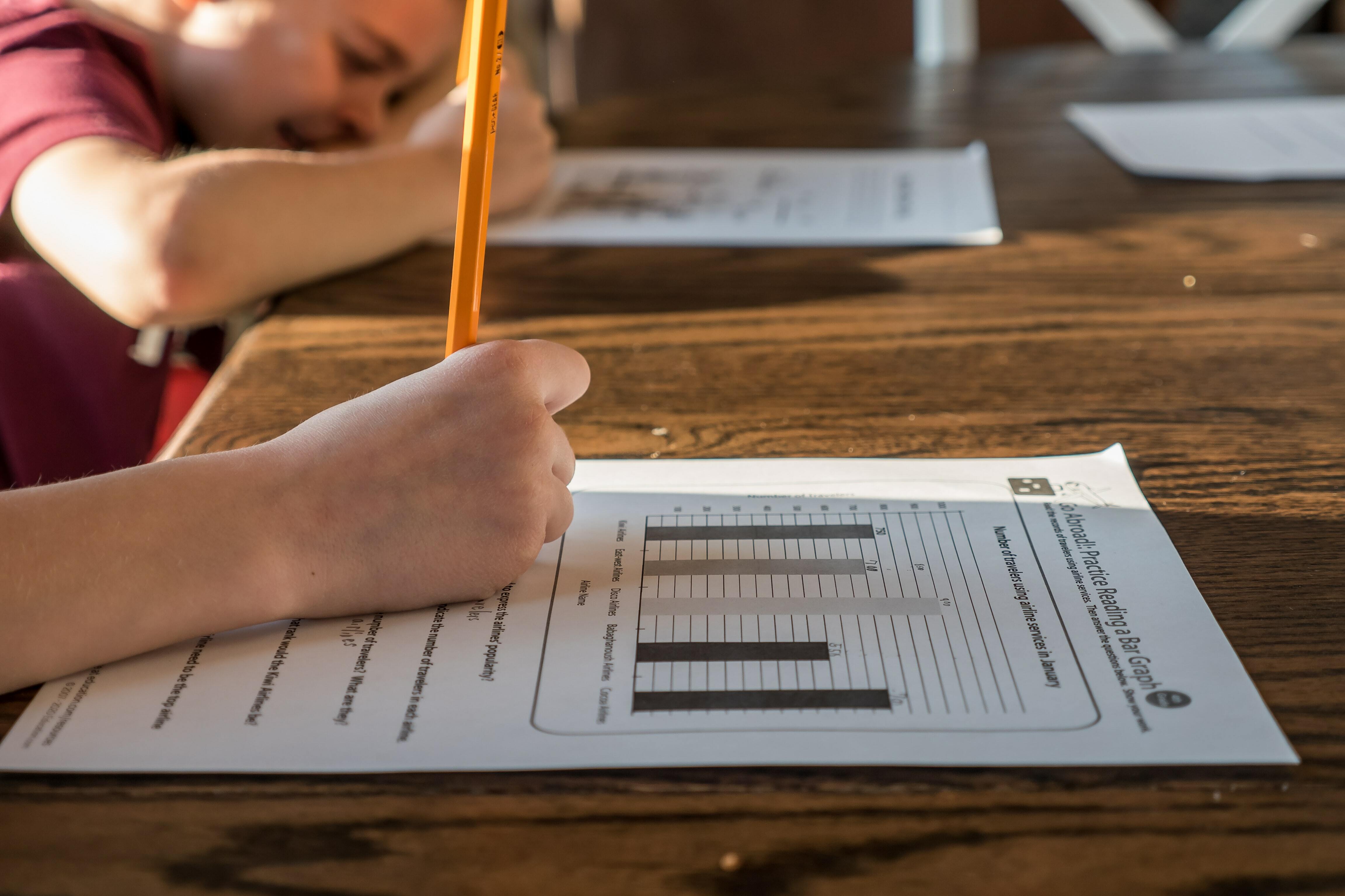 A child writing with a pencil