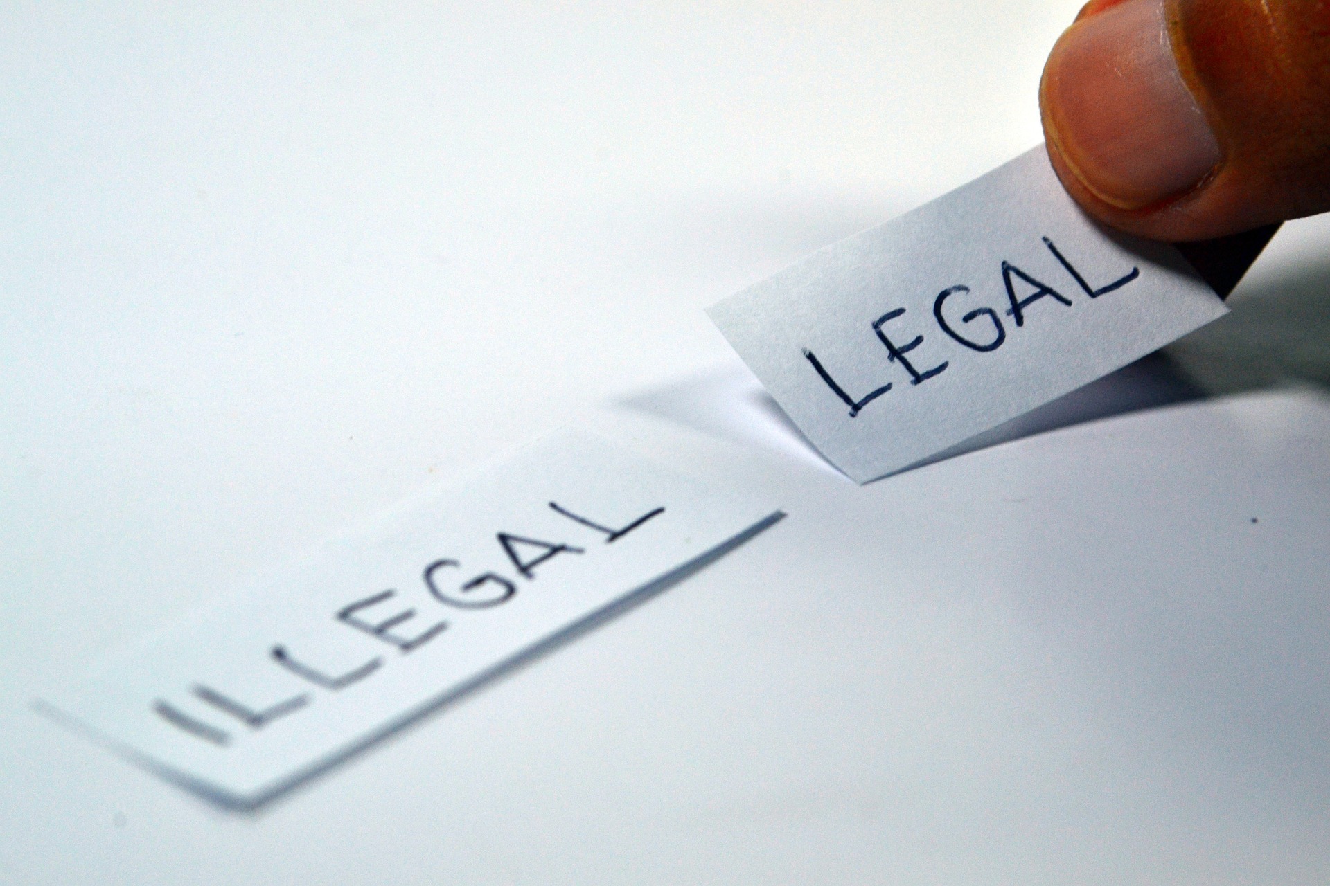 Legal and illegal written on paper