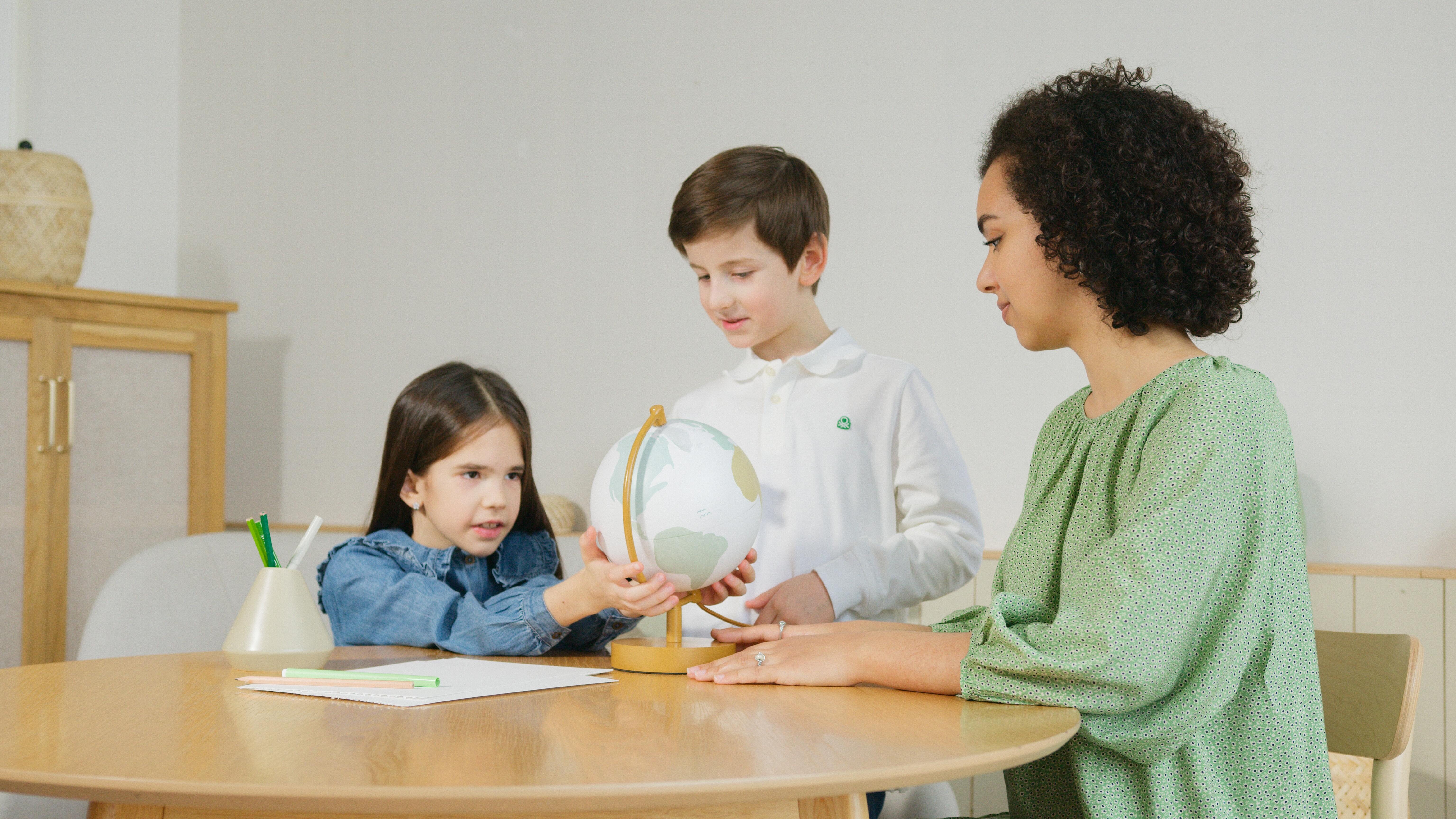 A woman homeschooling her children