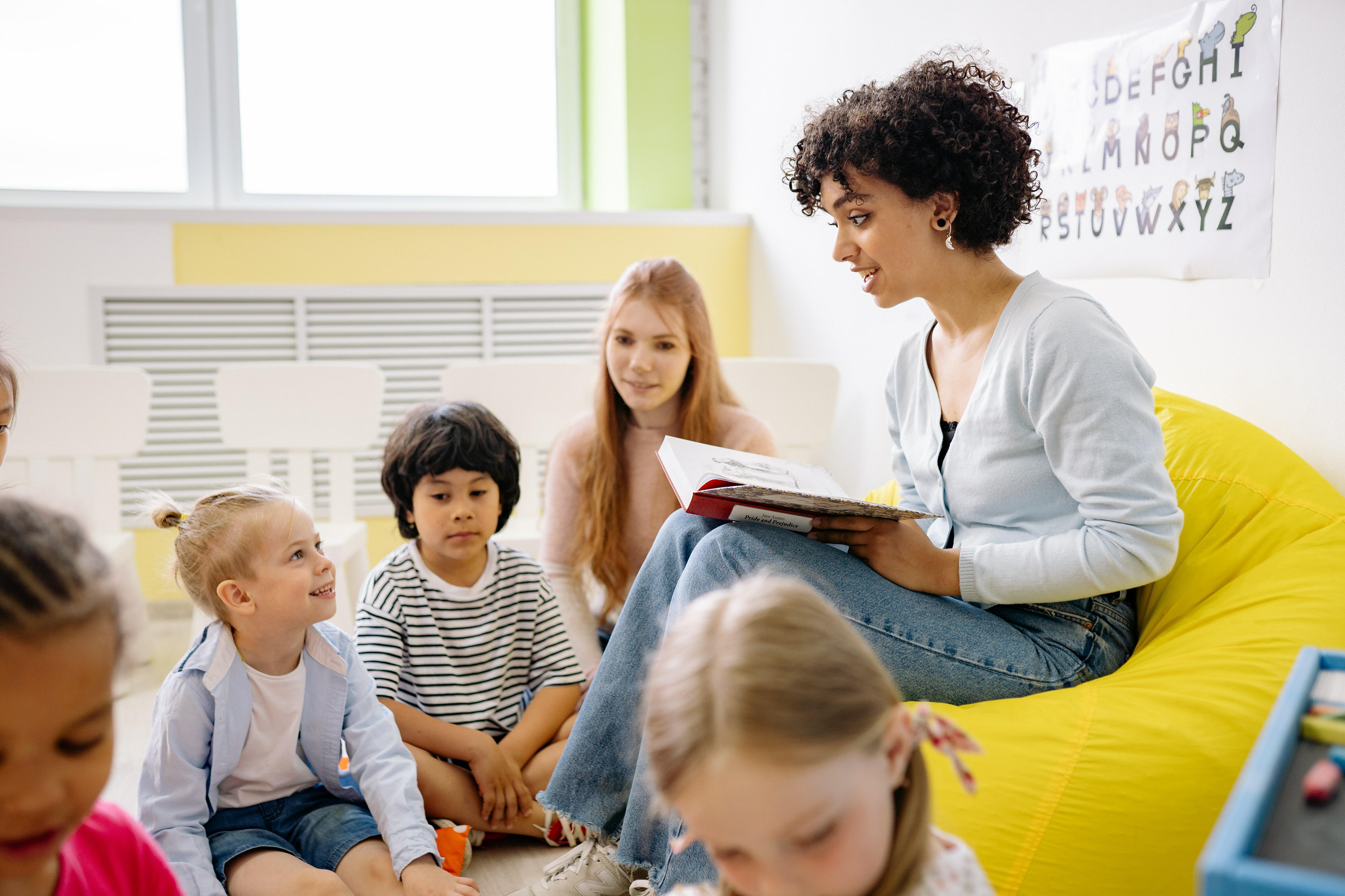 A woman teaching children