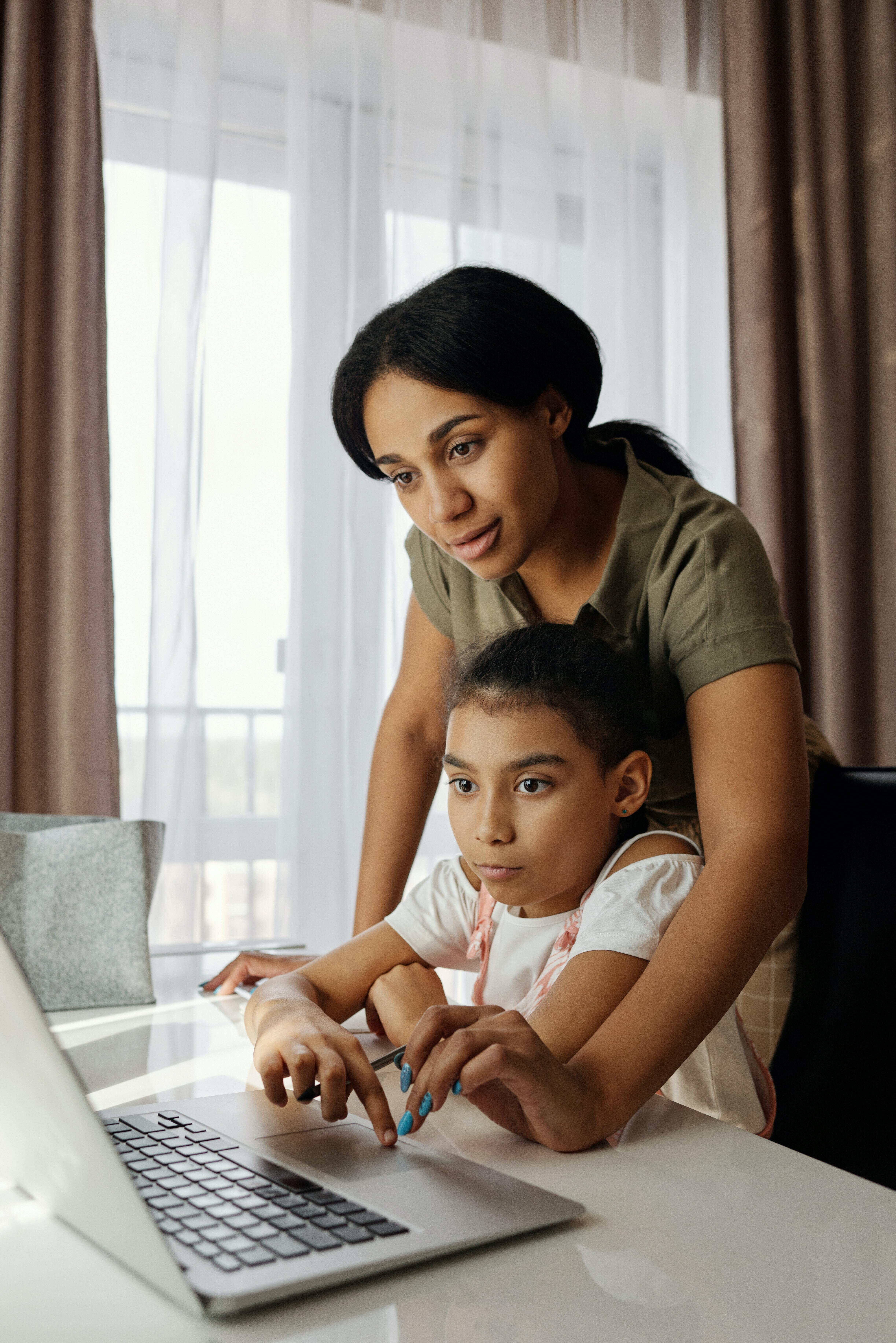 Woman and child using a laptop