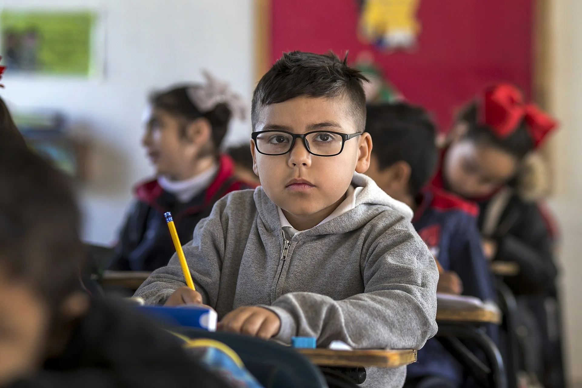 Boy holding a pen