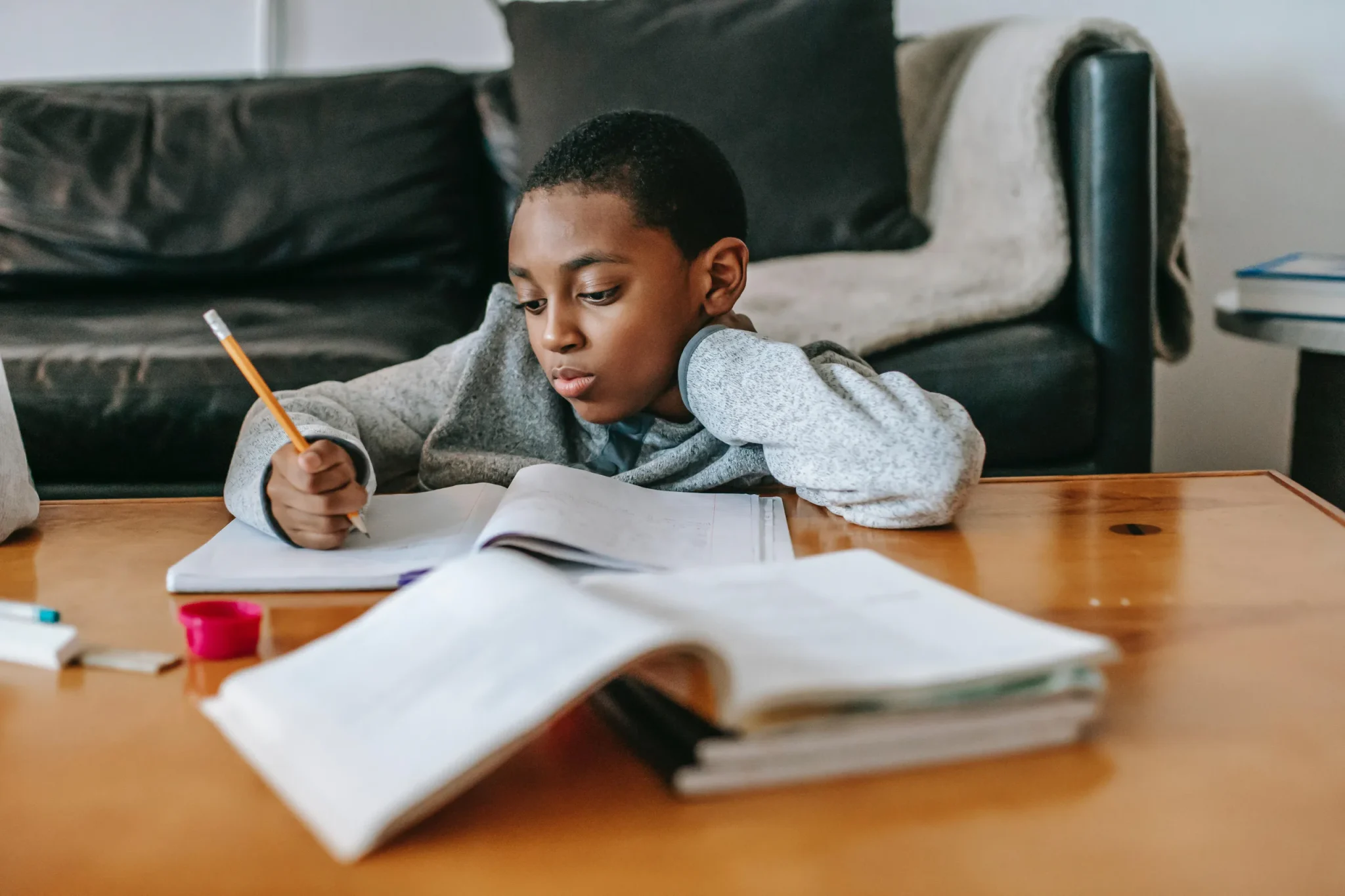 A child writing on the table
