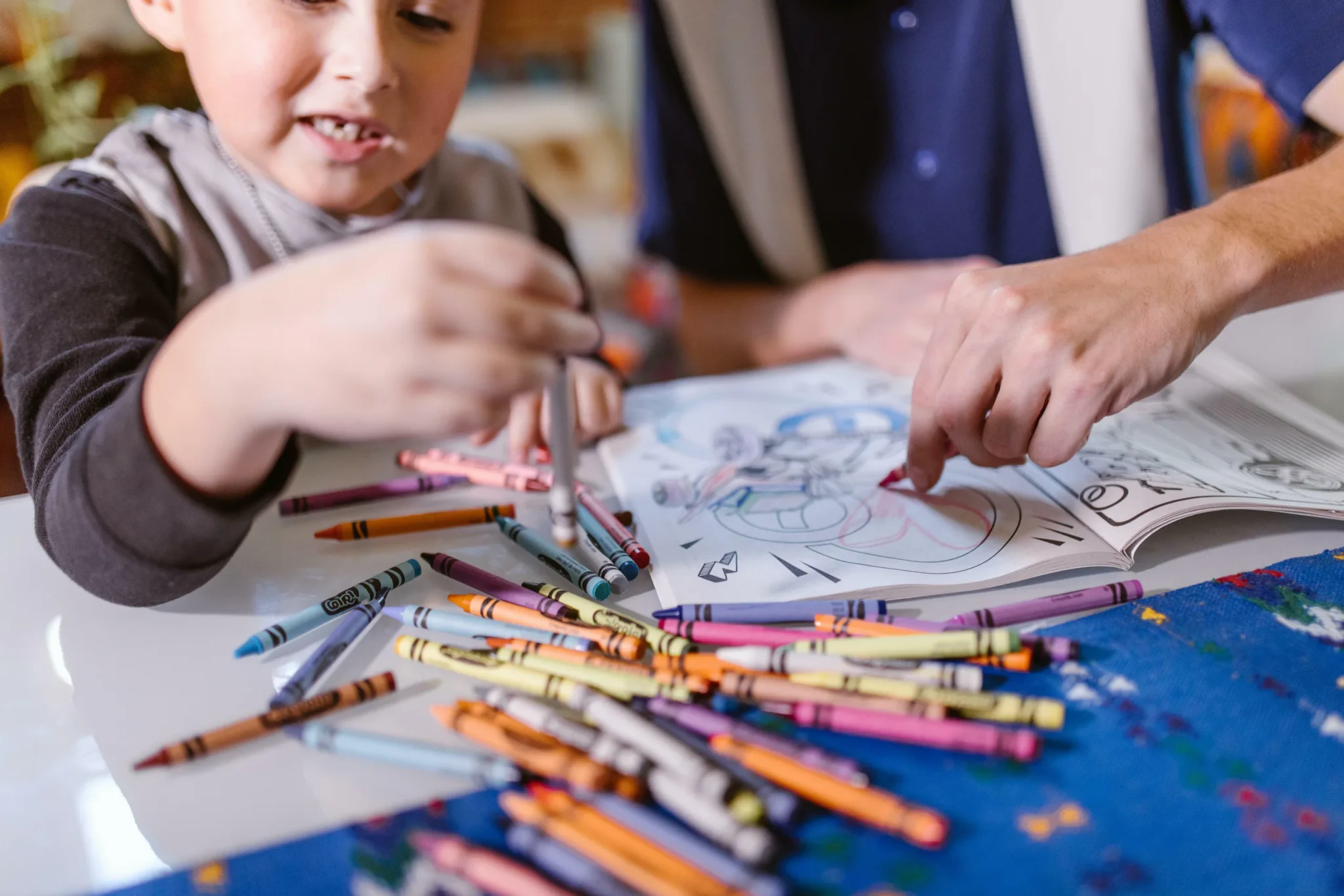 A child holding a crayon