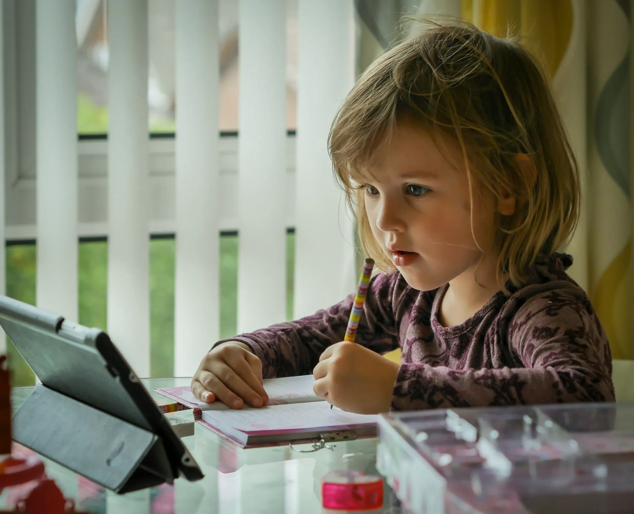 A child writing on a book