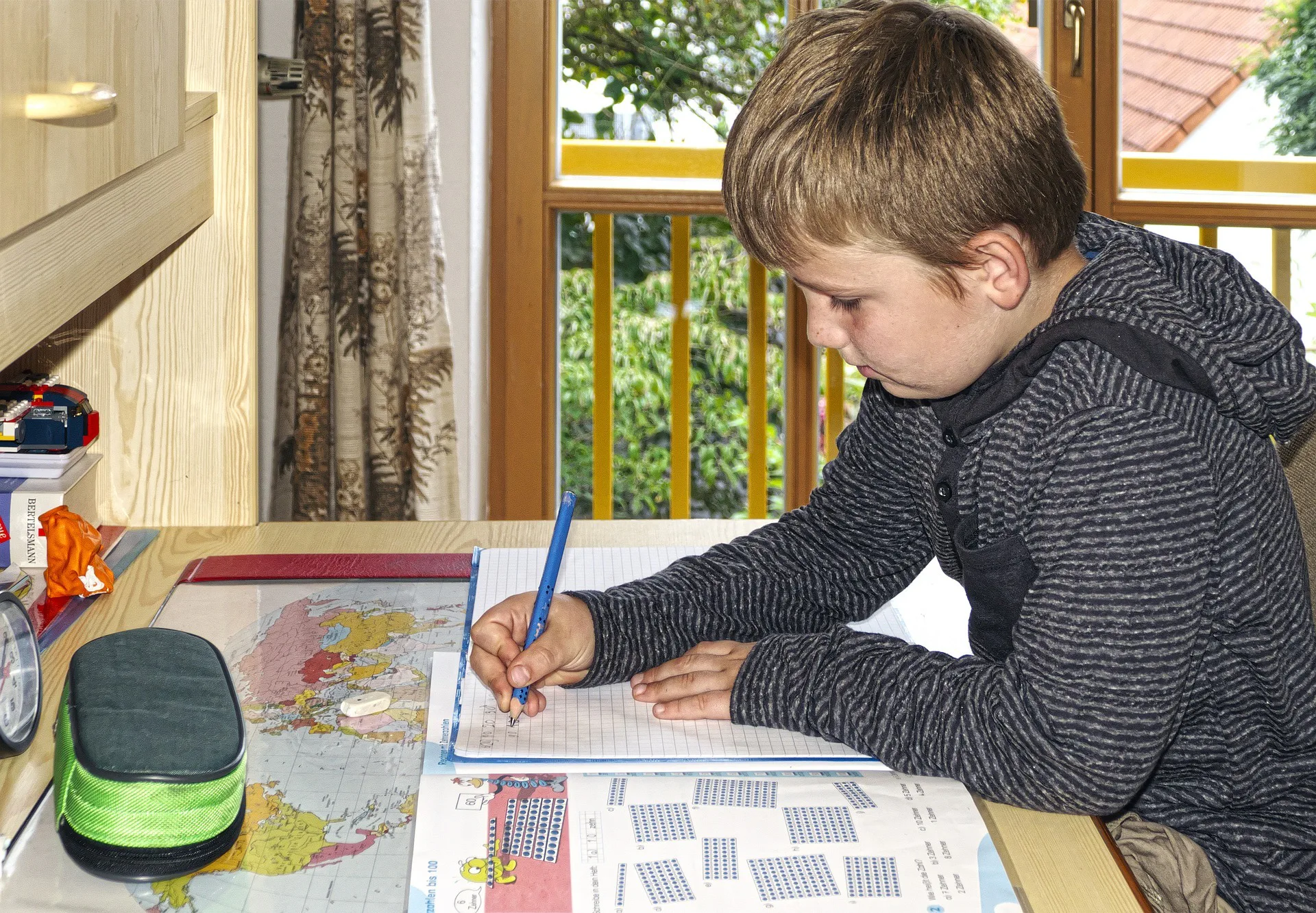 A child writing on a book