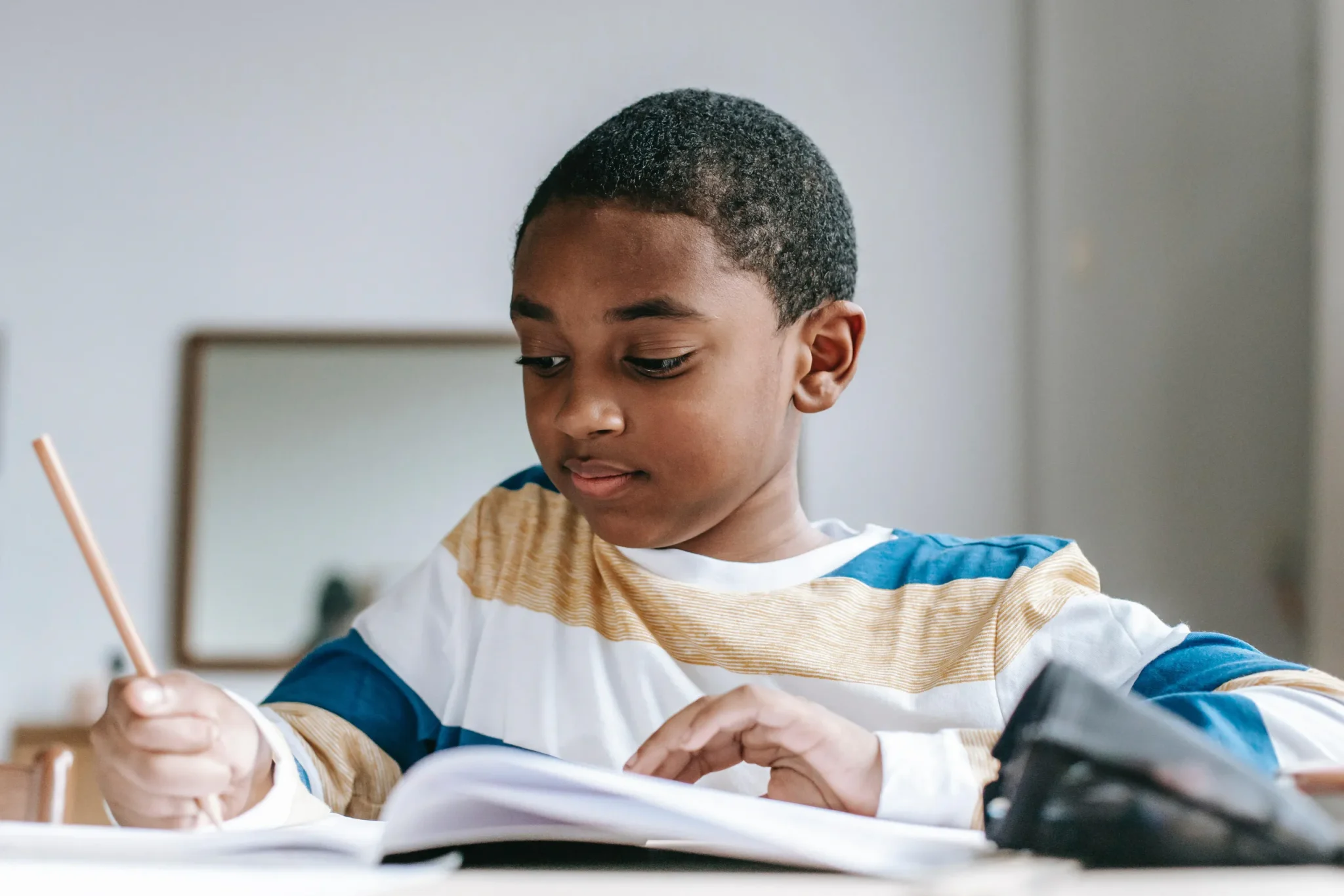 Child writing on a book