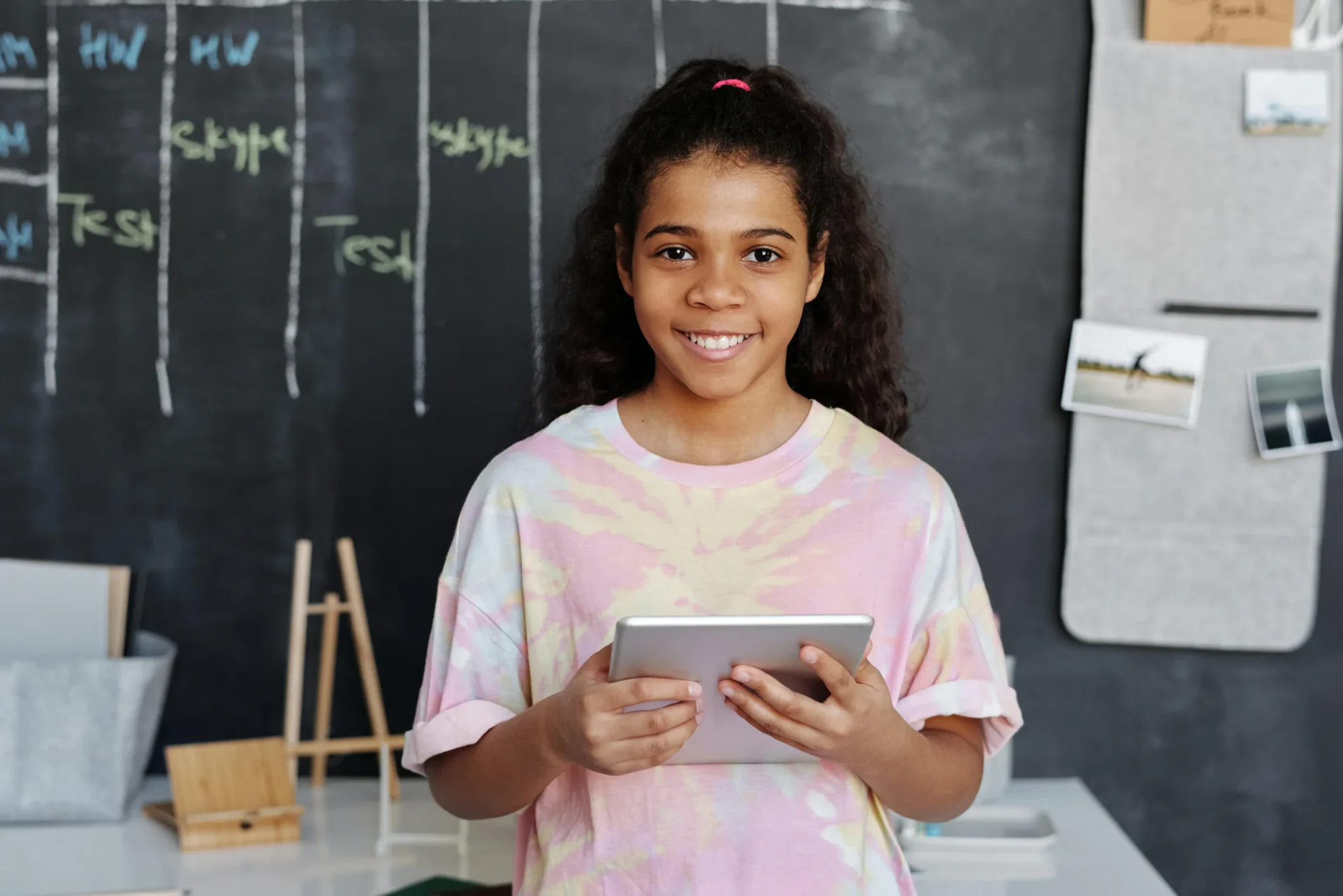 A child holding a tablet