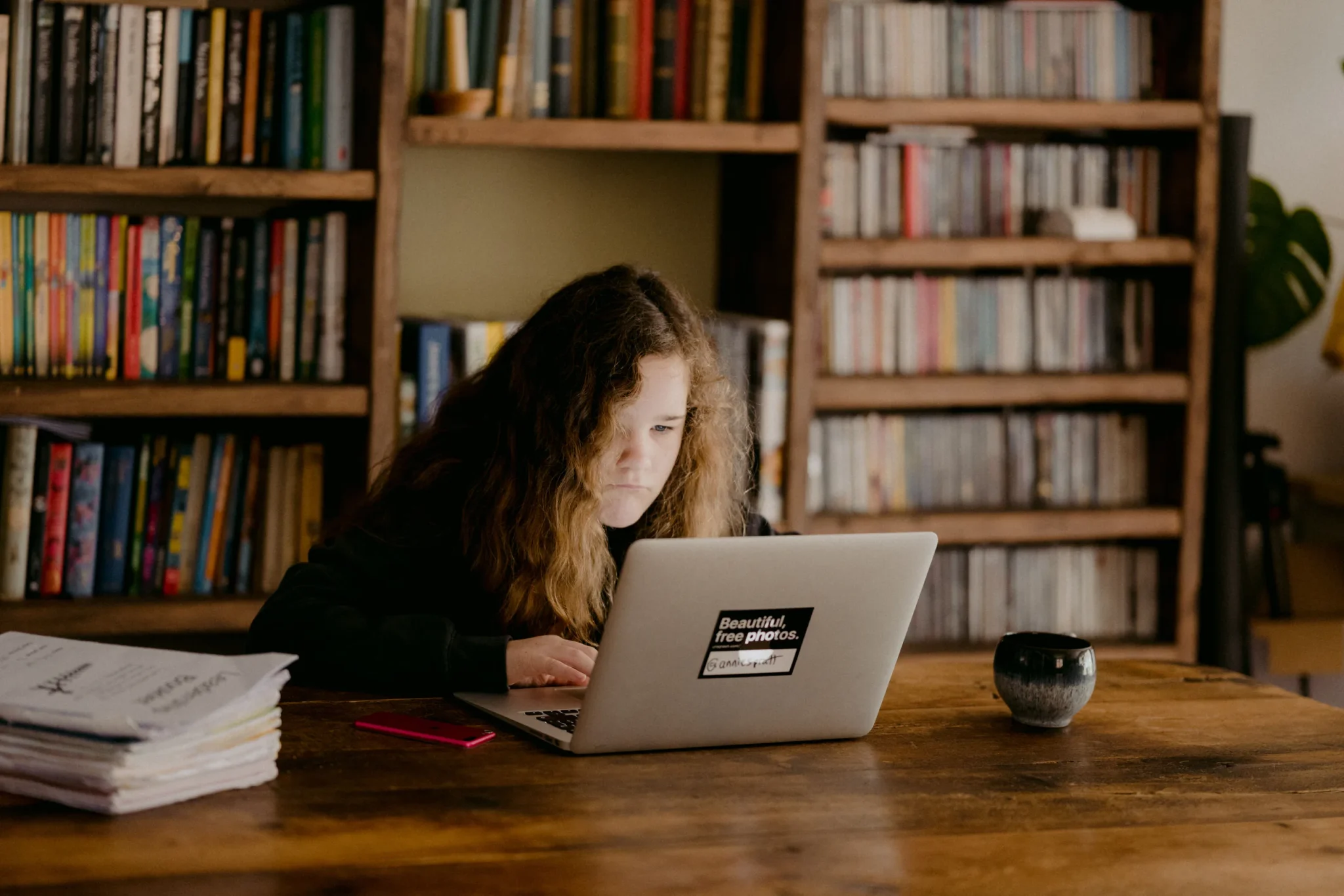 A child staring at a laptop