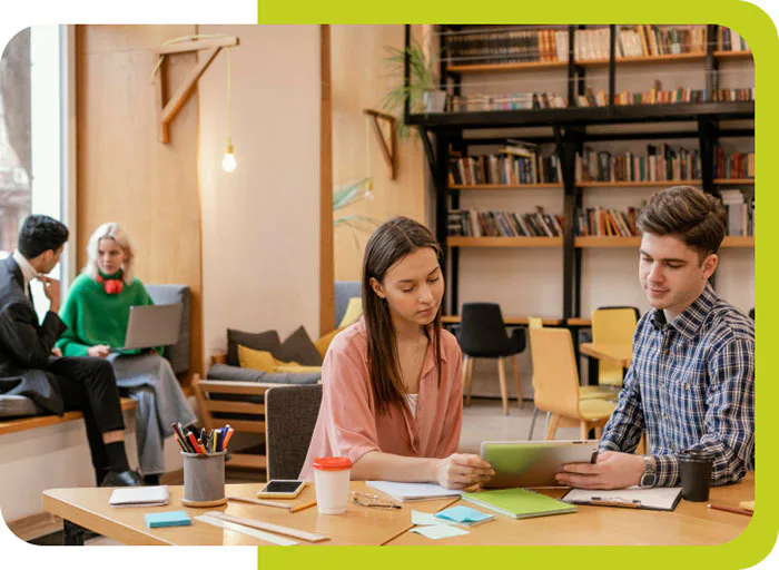 A man and woman looking a paper together Great Home School Convensions