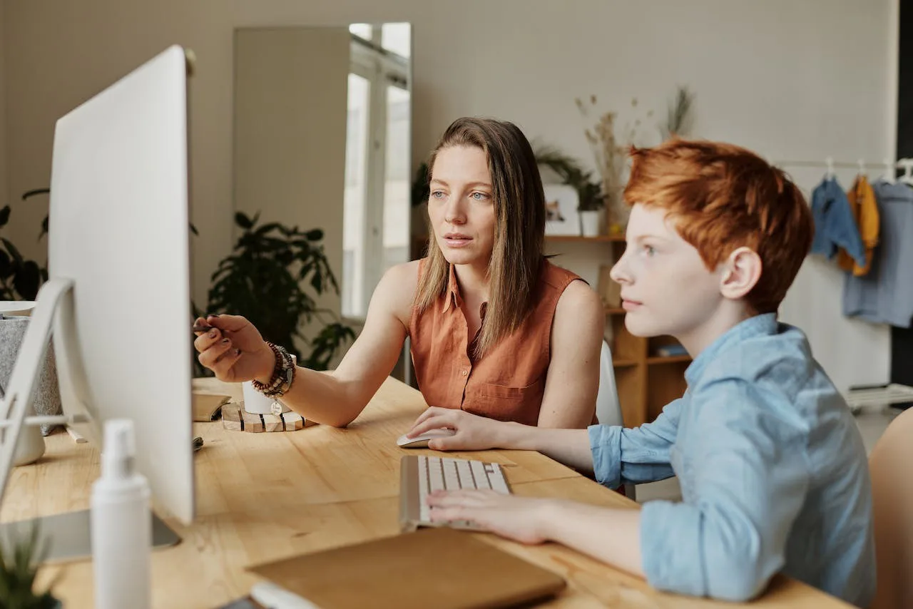 A mother and child using Computer Great Home School Convensions