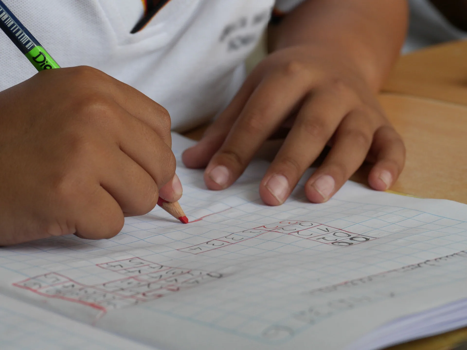 A boy writing on a paper