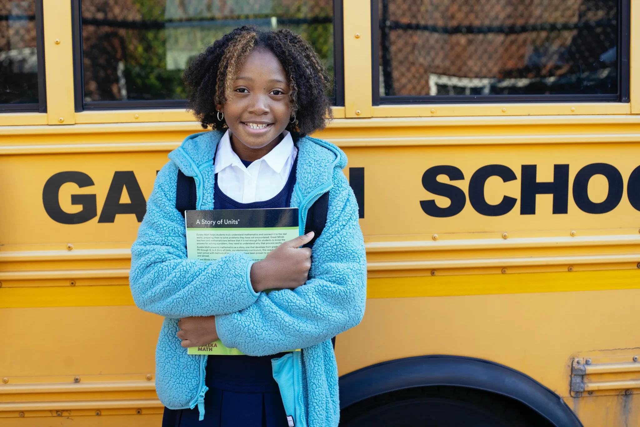 Pupil in front of bus