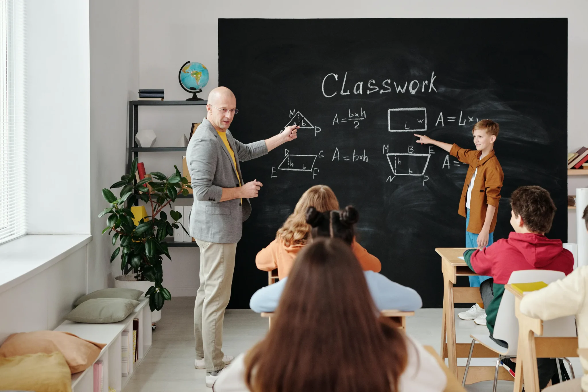 Teacher and pupils in class