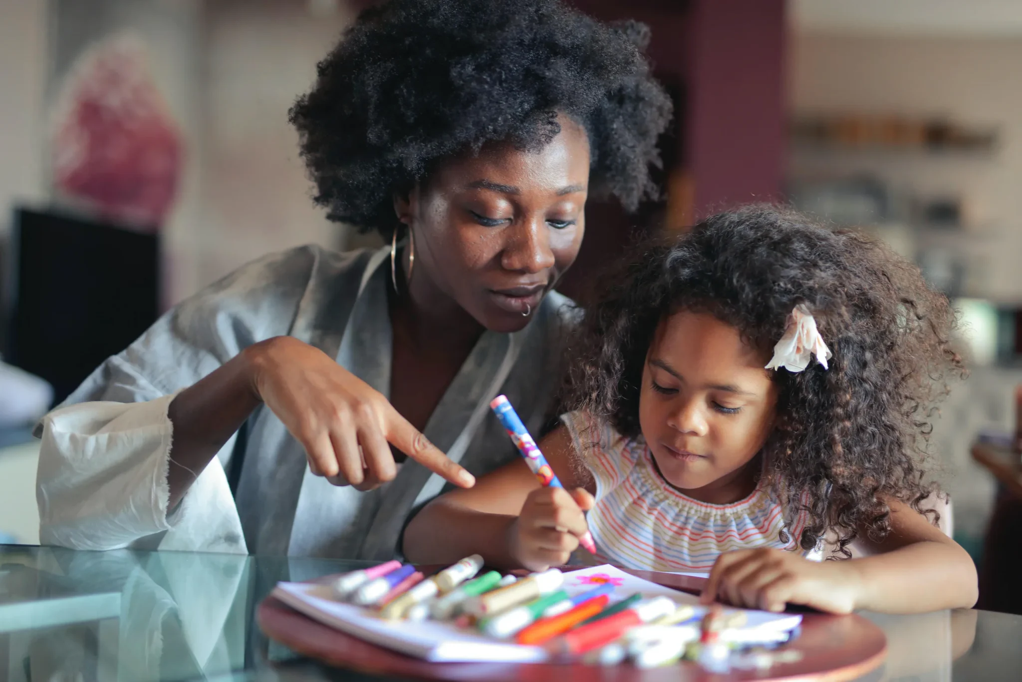 A woman and a child painting
