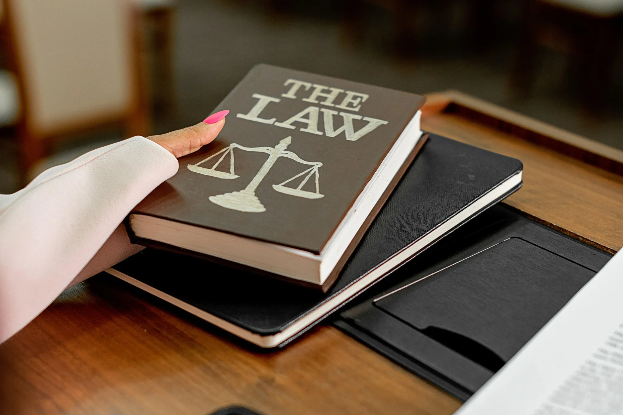 A woman holding a law book