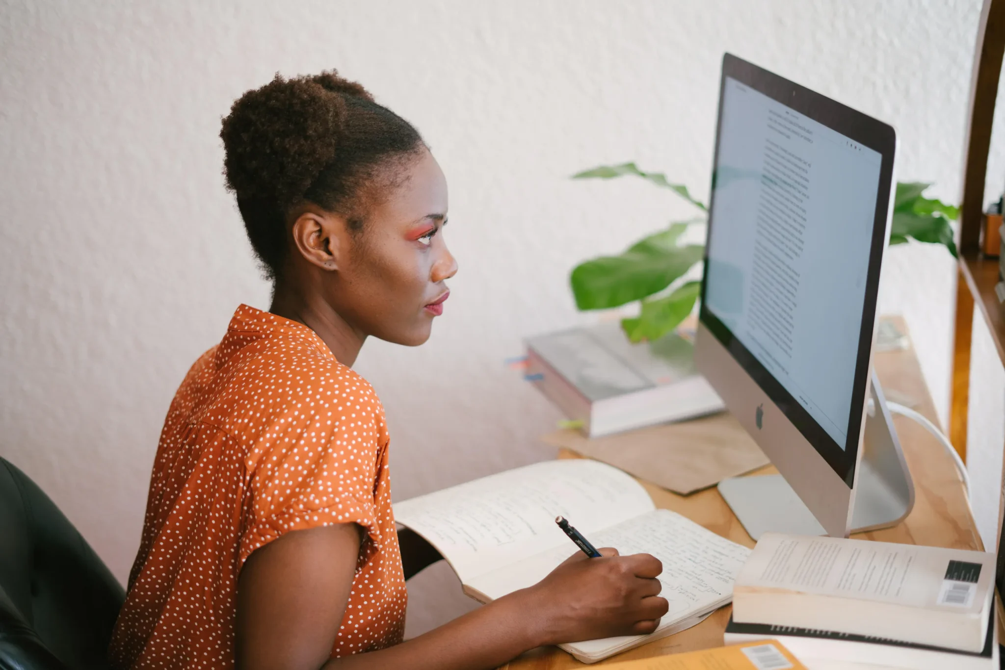 A woman working in front of computer