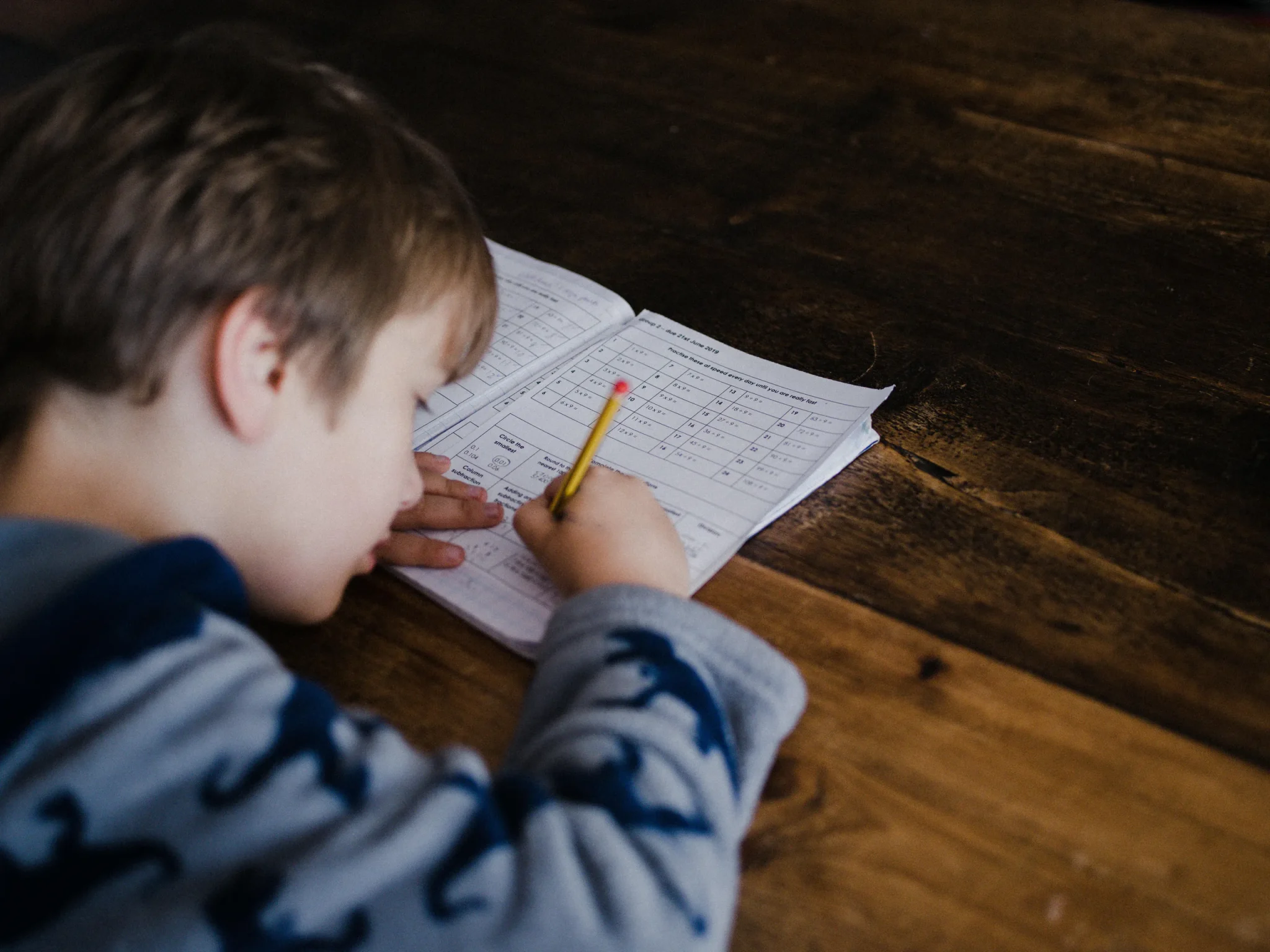A child writing on a book