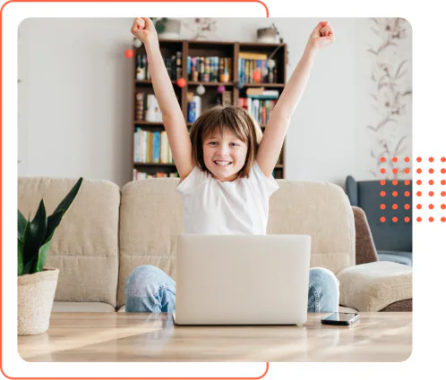 Girl at laptop arms raised