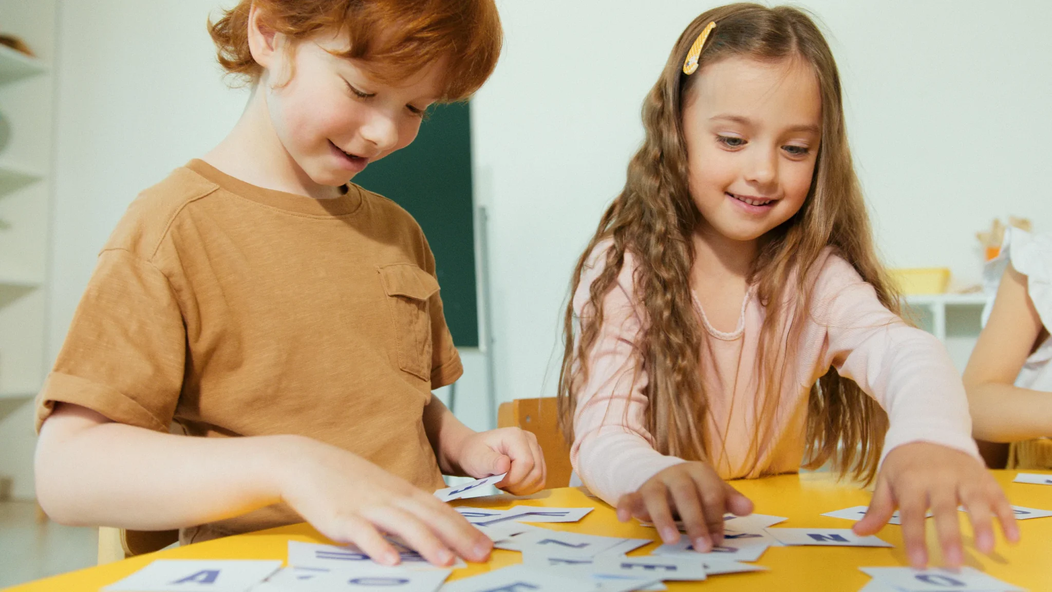 Children arranging alphabets