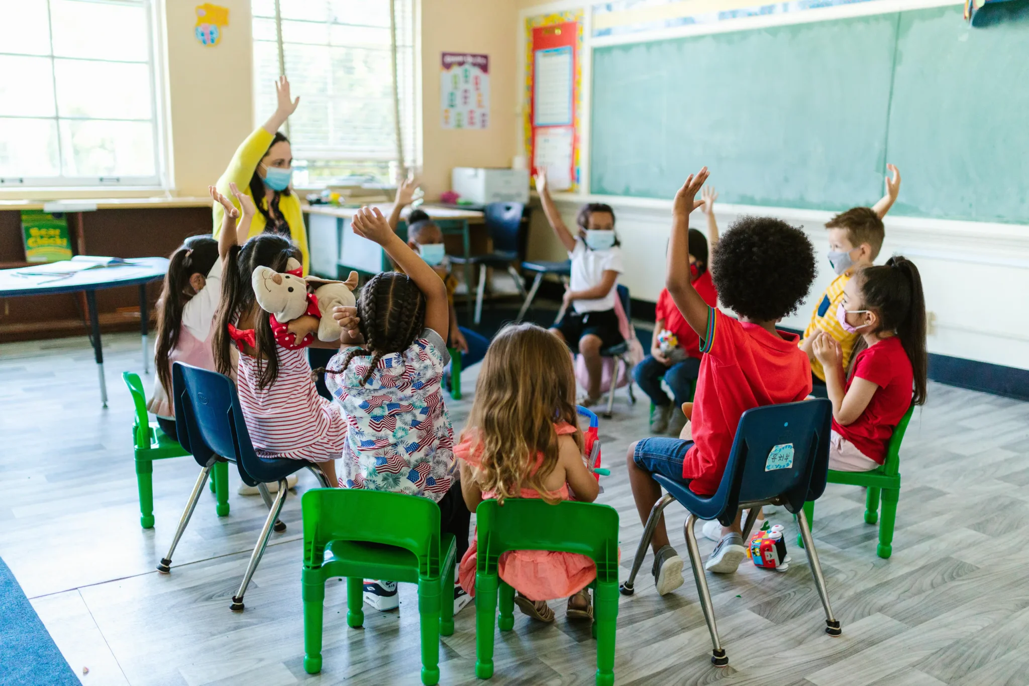 Children raising their hands