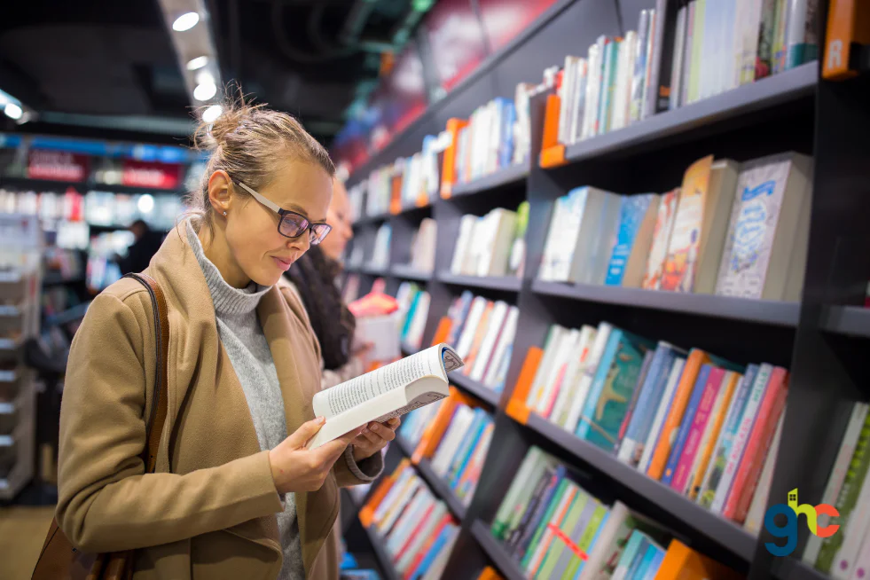 Someone reading from a library