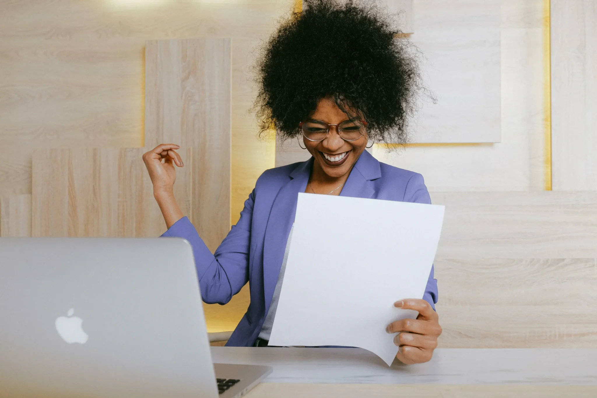 Happy woman behind a laptop