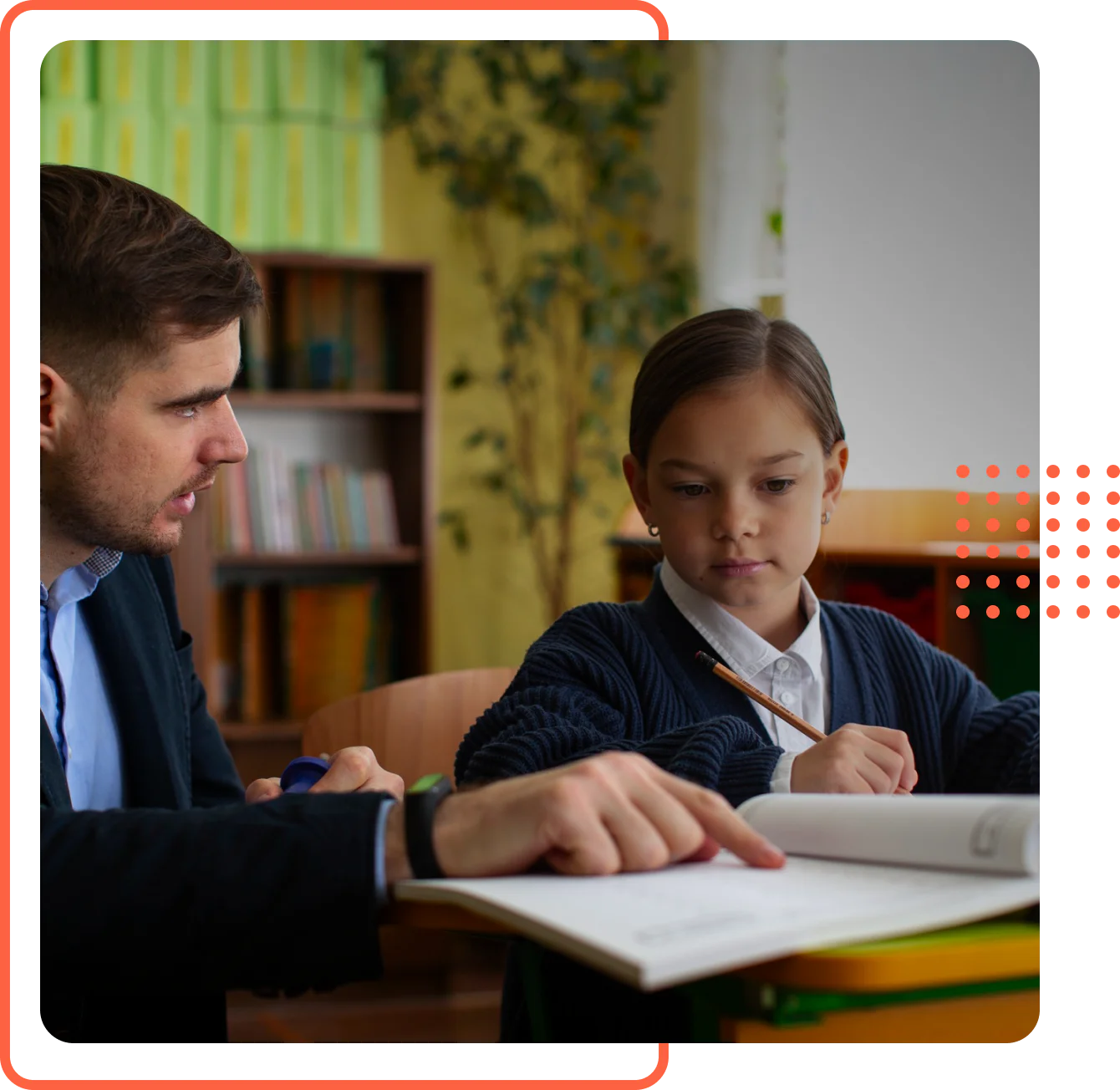 A man pointing at an open book to guide a young girl holding a pencil during a homeschool lesson