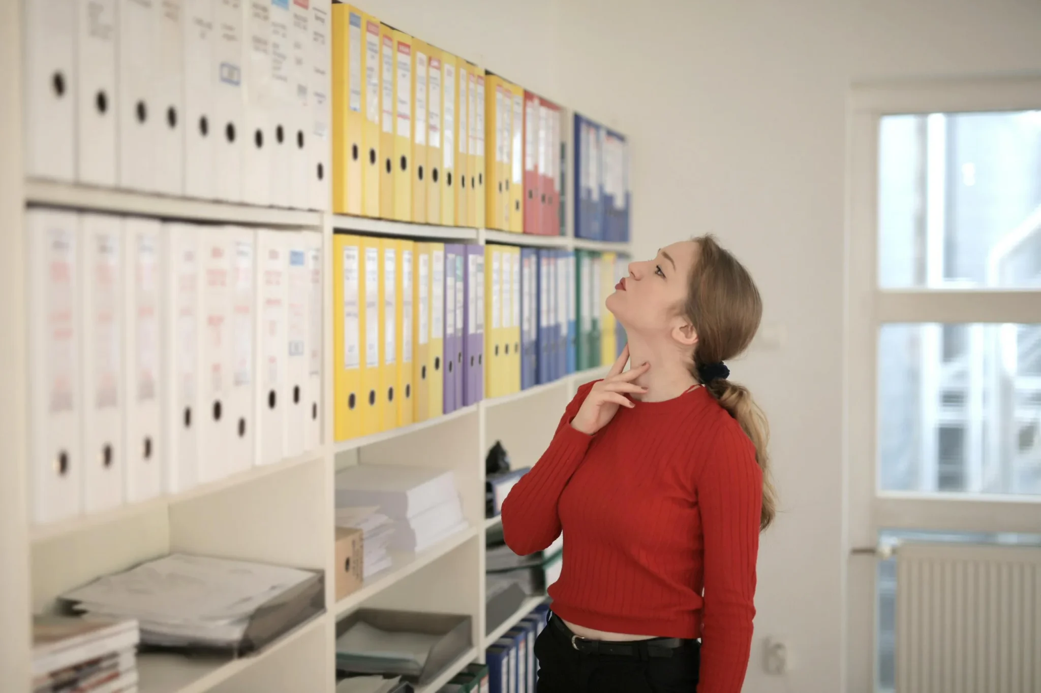 A lady going through a library of books
