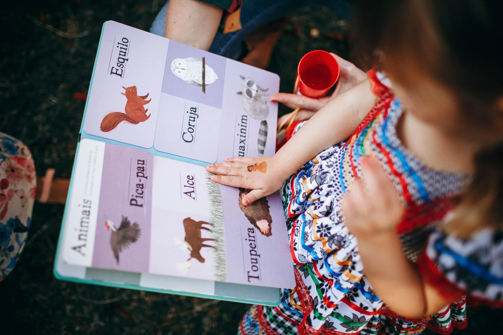 A child looking at a workbook