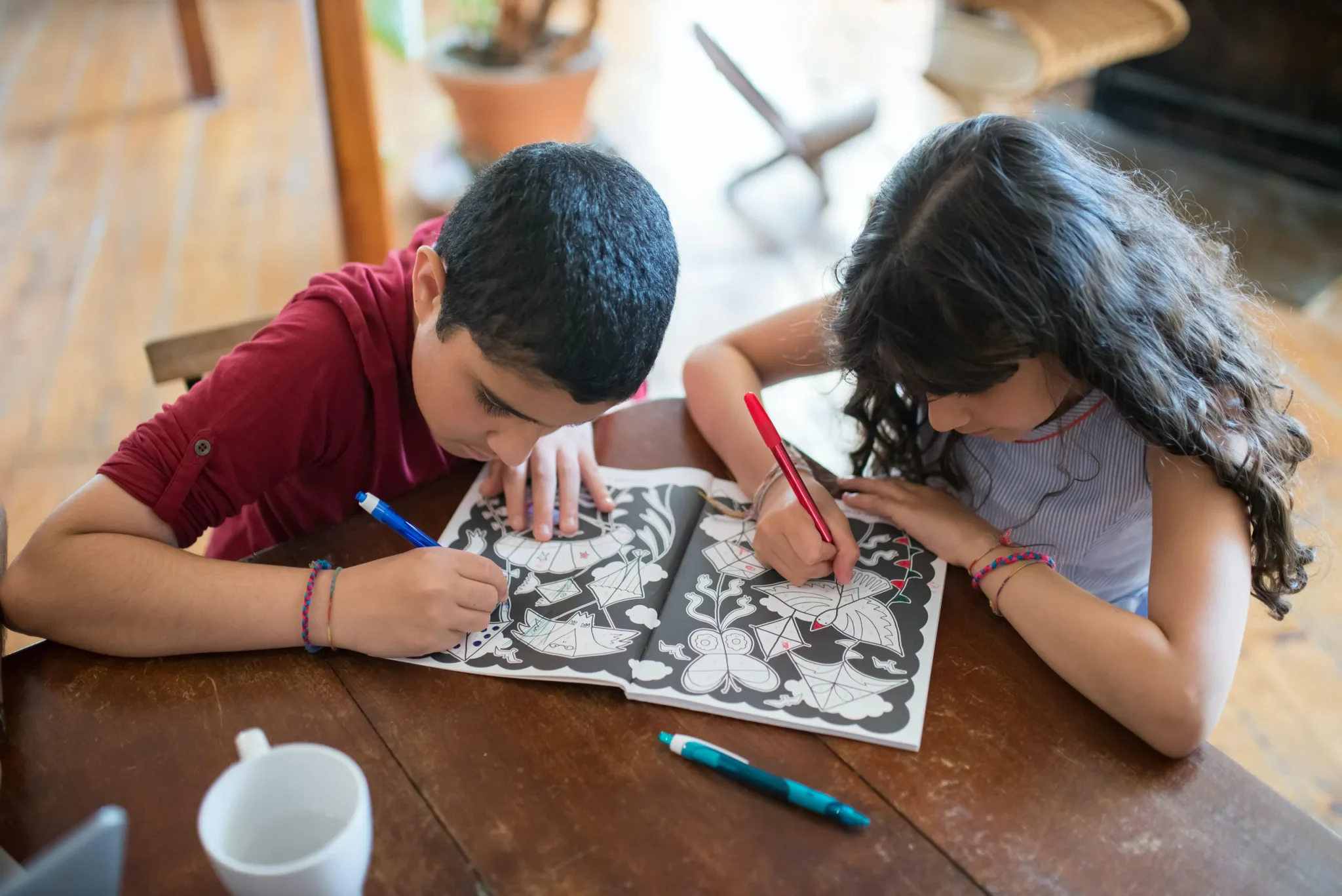 A male and a female child painting
