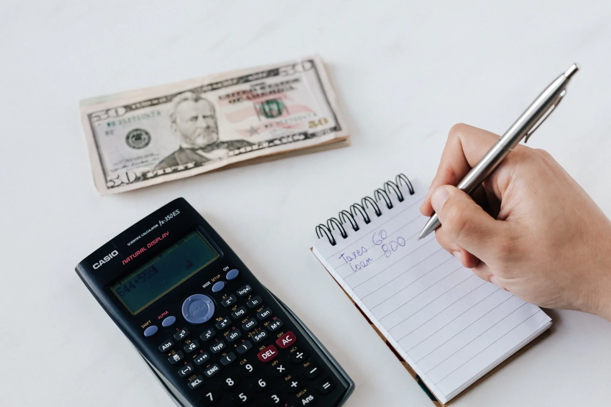 Someone calculating money