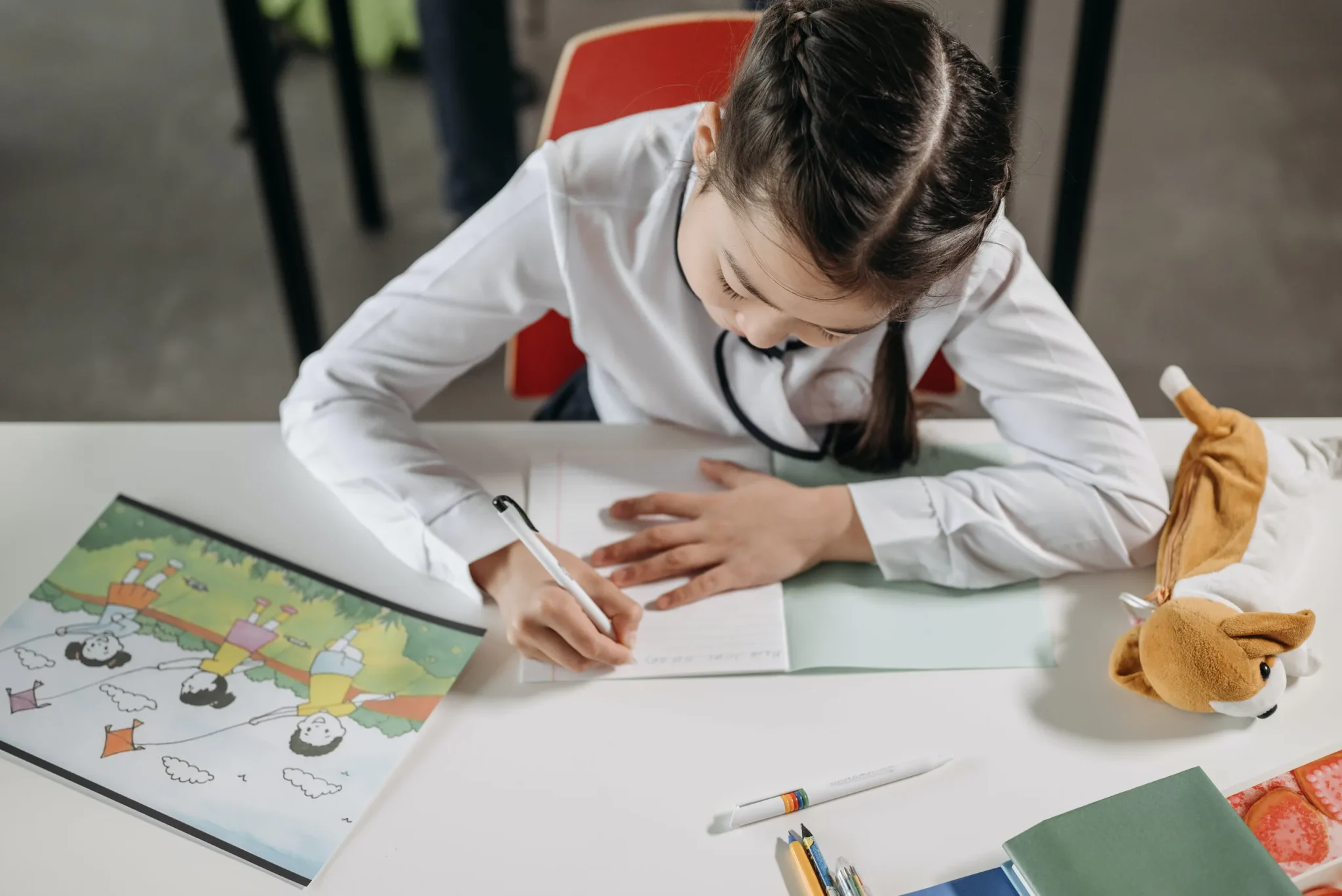 A child writing on a book