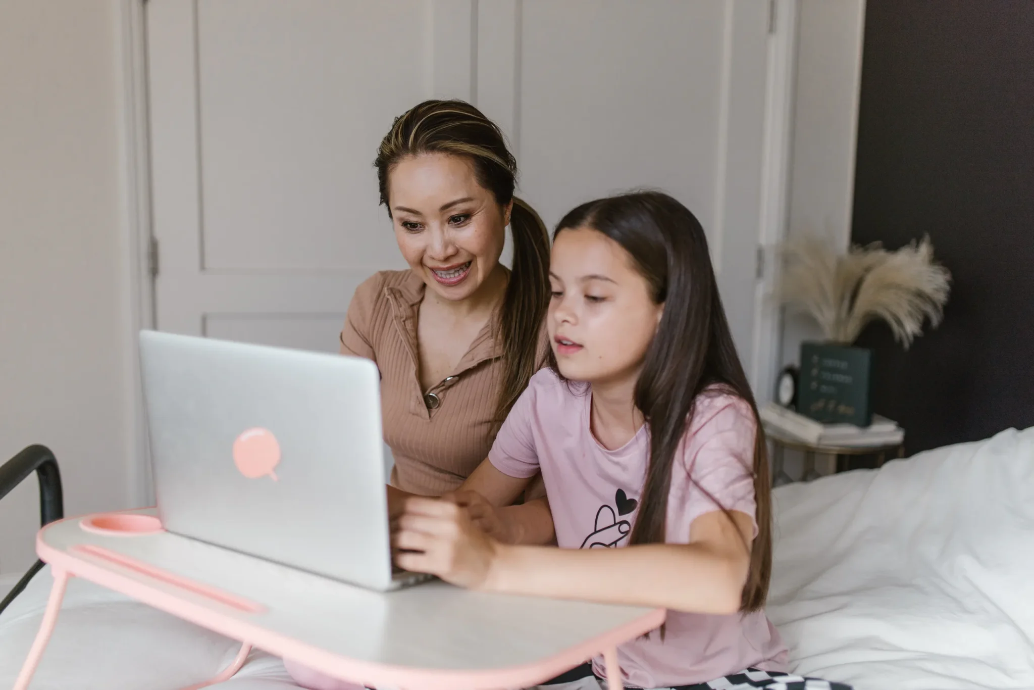 Mother and child using a laptop