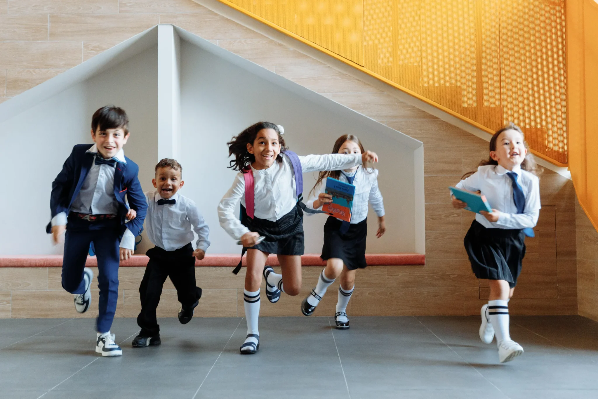 Pupils running in school uniform