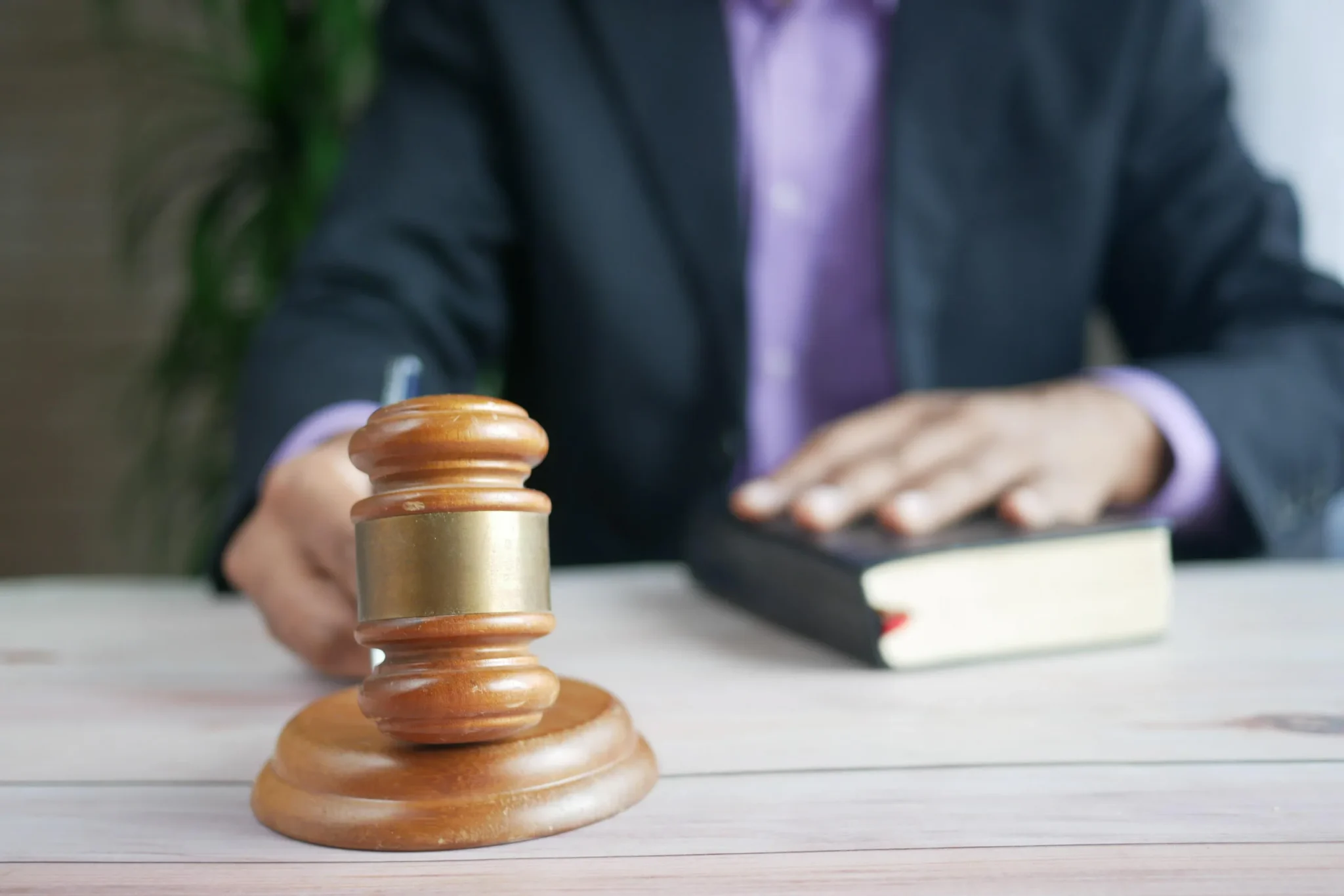 Someone holding a gavel