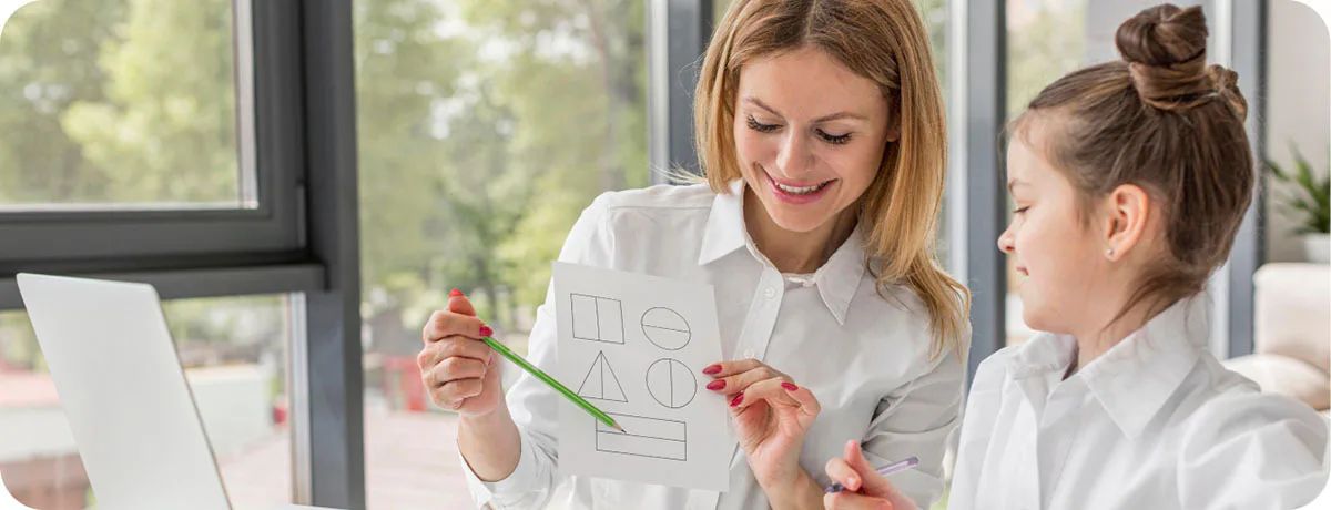 Teacher Showing Geometroy to a Student Great Home School Convensions