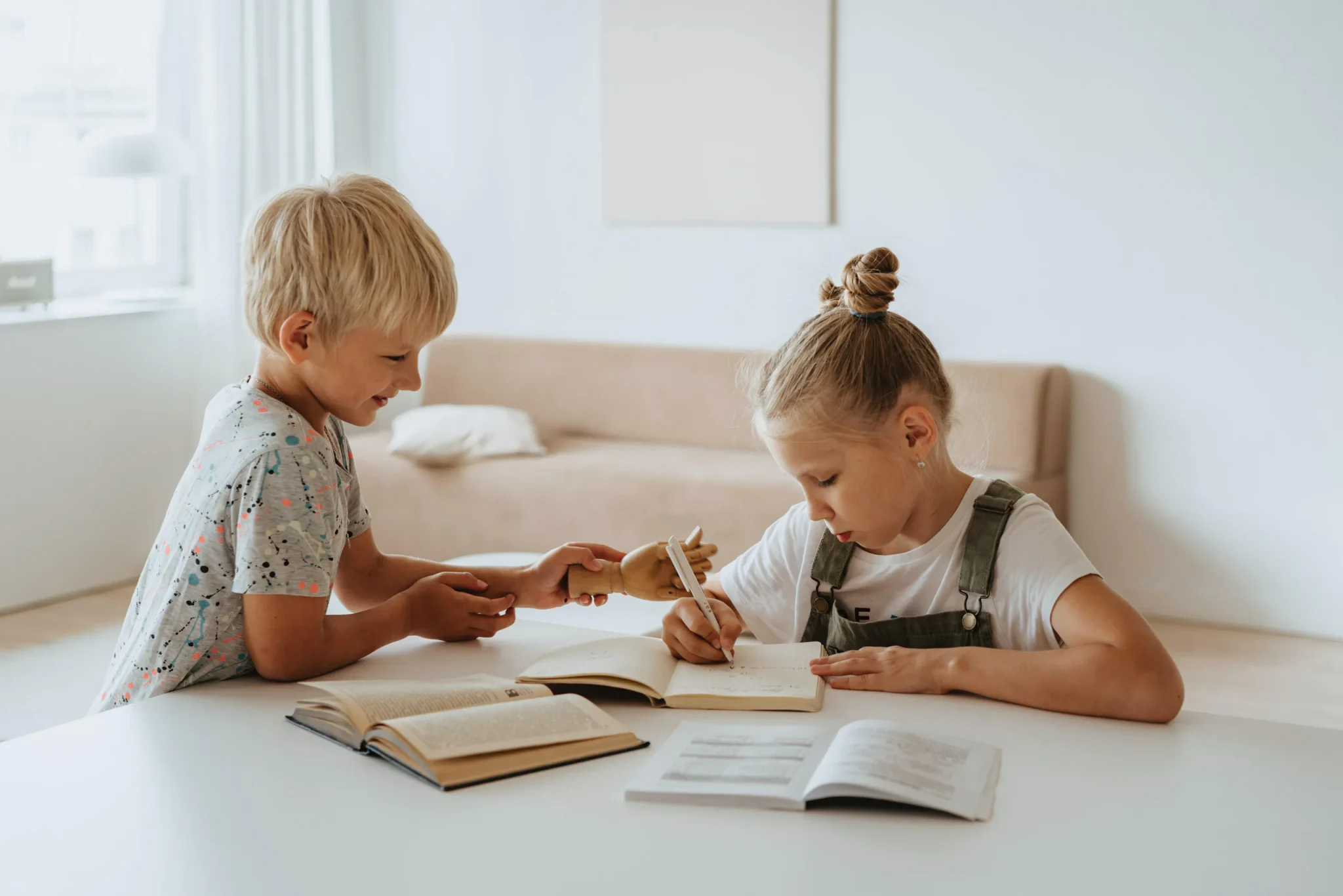 Two children writing